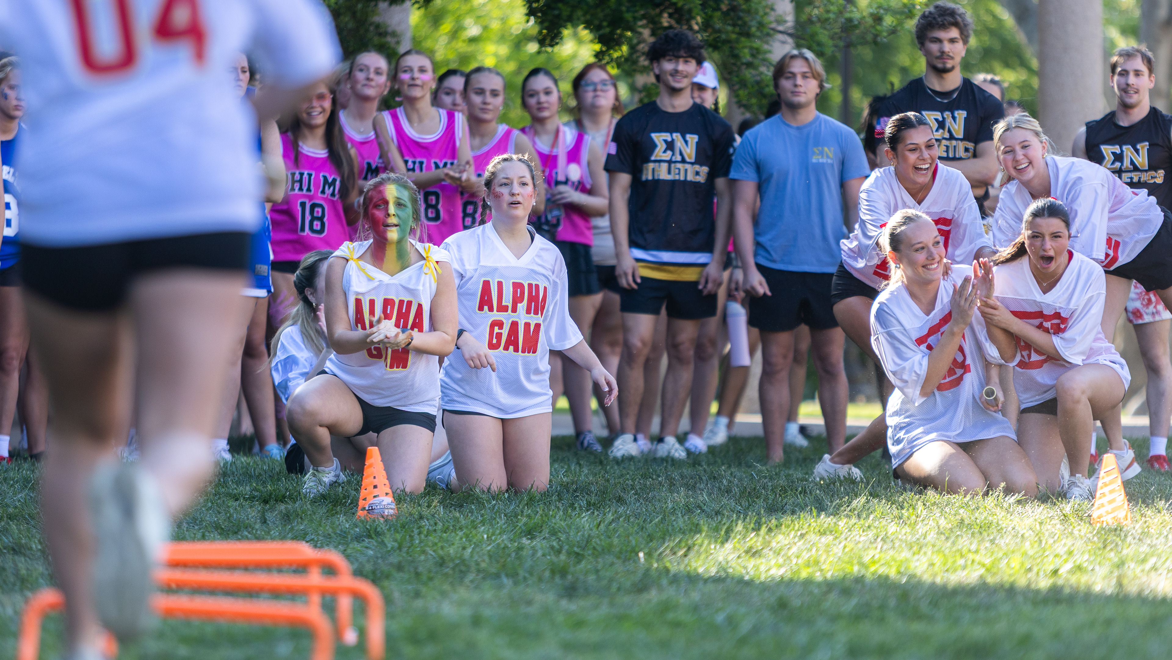 Members of the Alpha Gamma Delta chapter, left, lose against the opposing chapter of Alpha Omicron Pi, competing in a relay race during “Event Day” for Greek Week at The Colonnades at Western Kentucky University in Bowling Green, Ky., on April 22, 2026. 