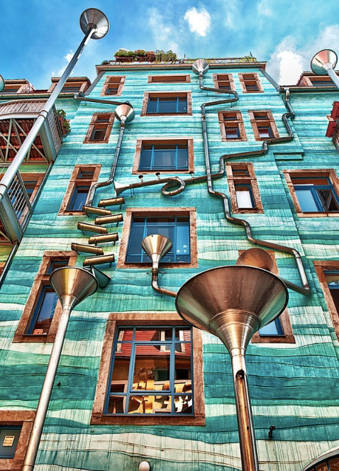 Kunsthofpassage Funnel Wall in Germany Metal funnels collect rain and turn in into music