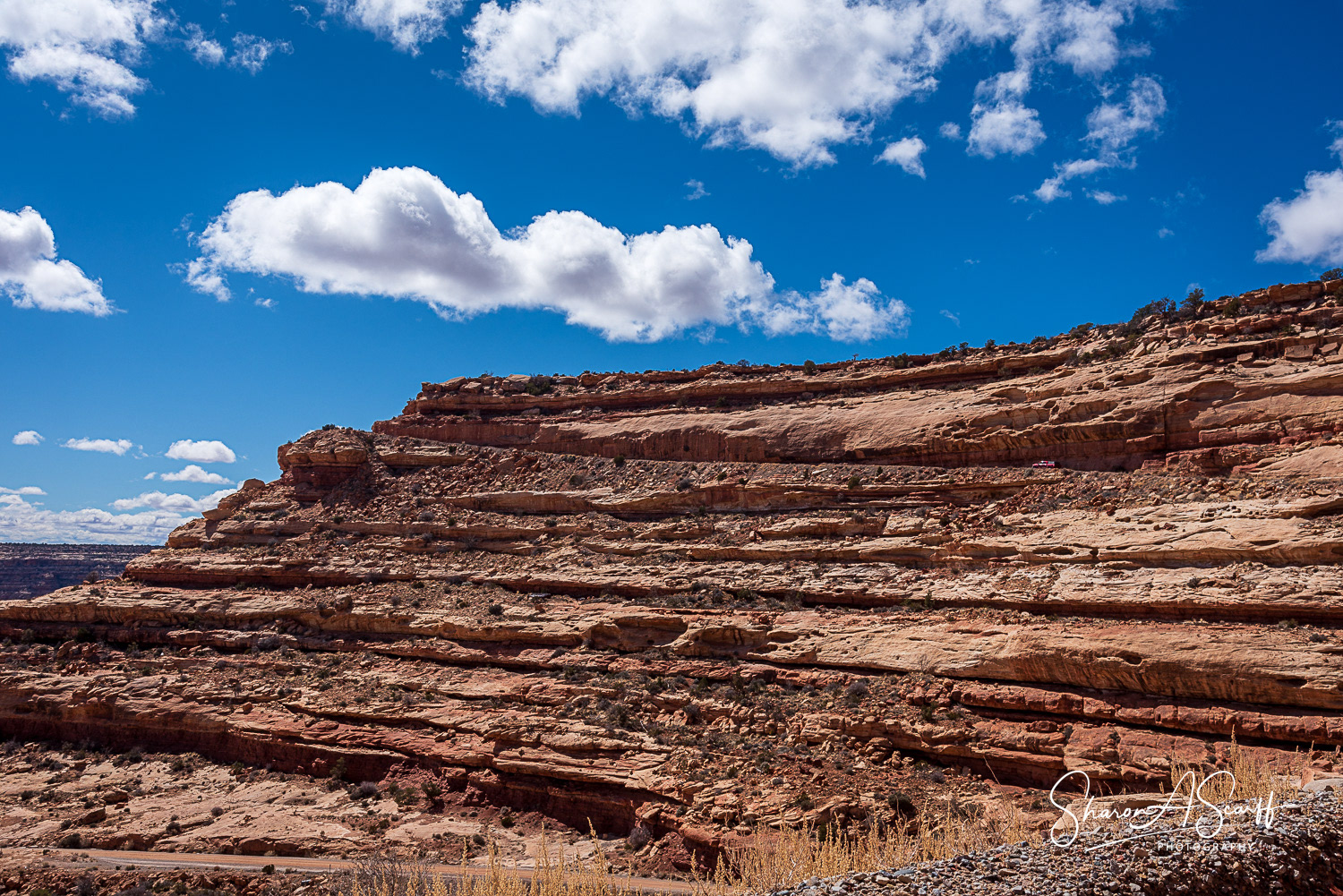 Note red vehicle towards the top of the cliff.