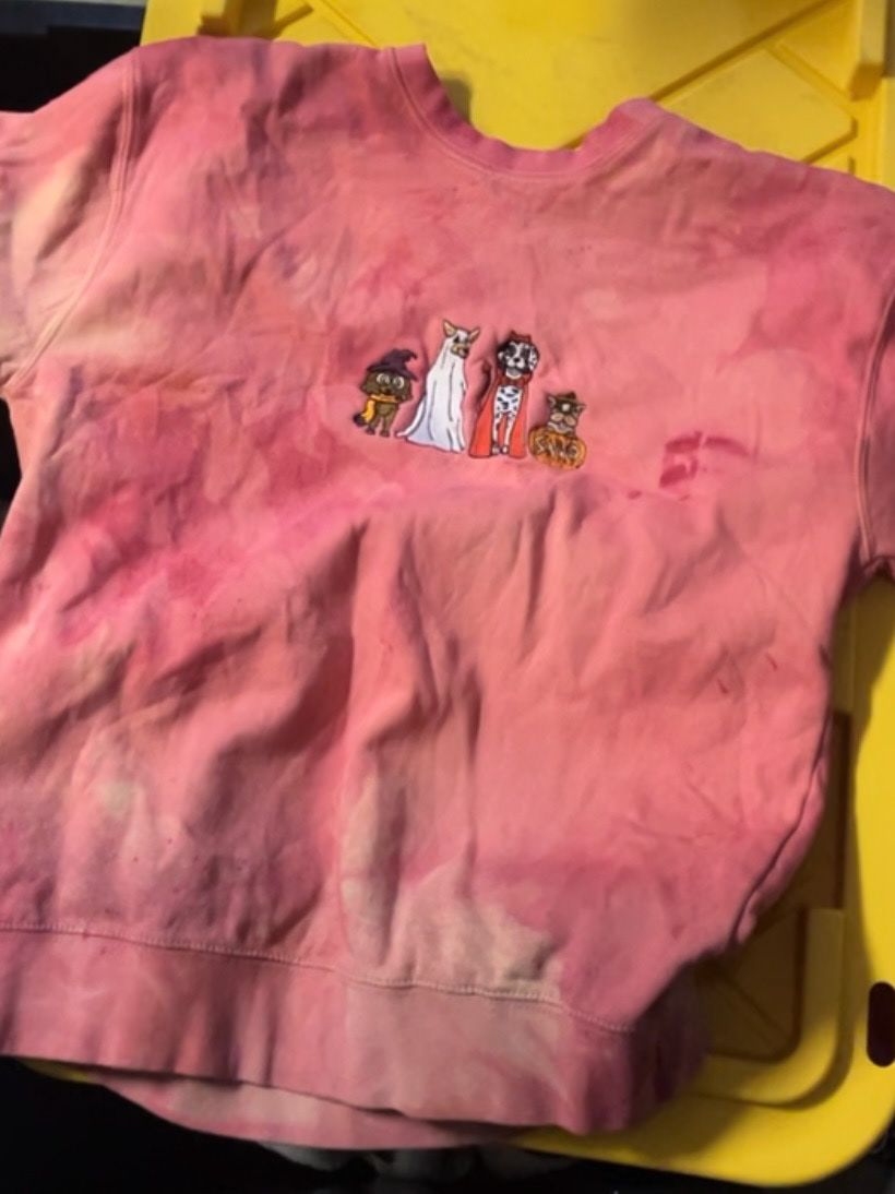 Poly/Cotton sweater with a "soft" exterior (more cotton) finish. The dye really took to the inside polyester but mixing in Procion MX dyed all the cotton a deeper richer hue. Really interesting/chaotic results. Featuring Halloween embroidery!