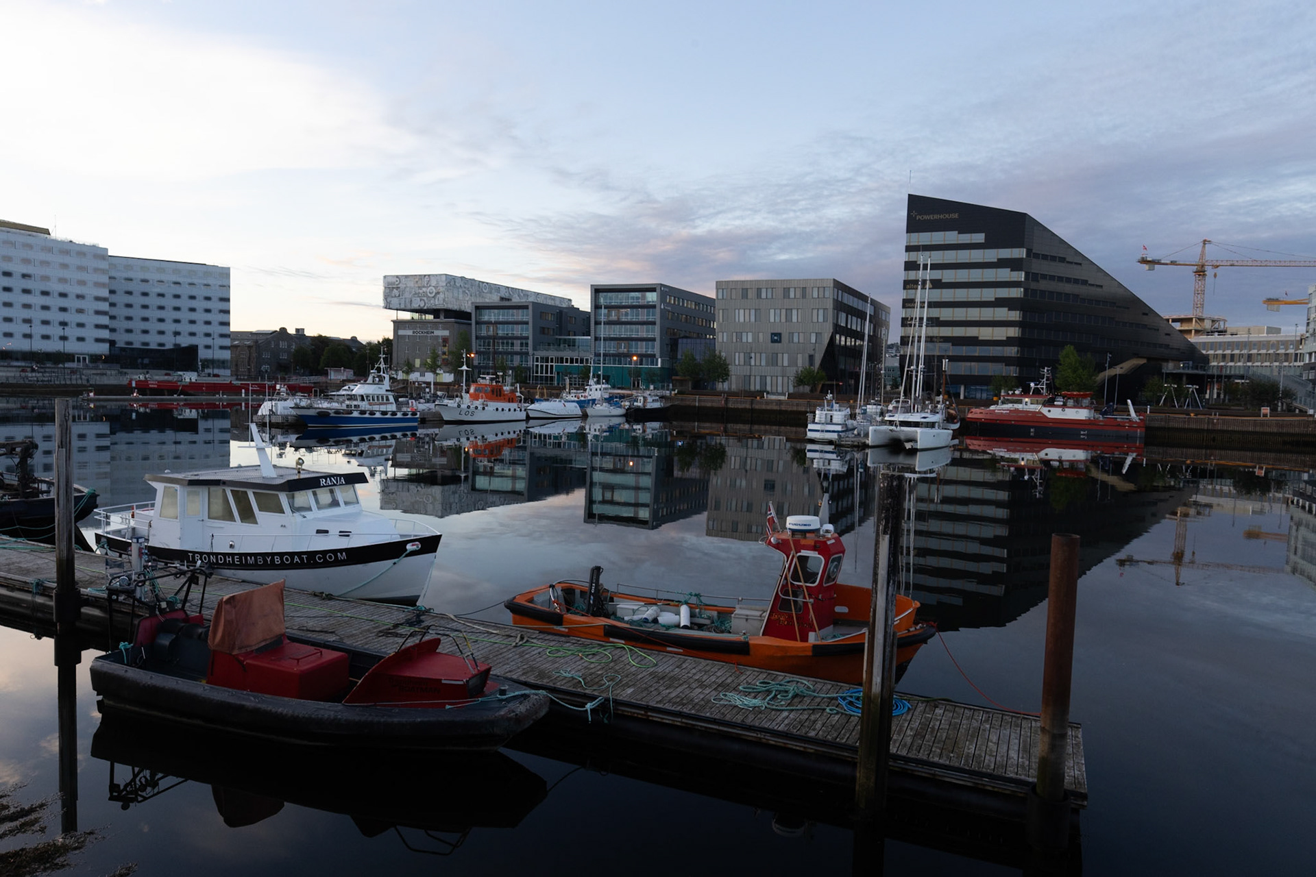 Local office space looking good in the mirror flat sea in Trondheim Harbour