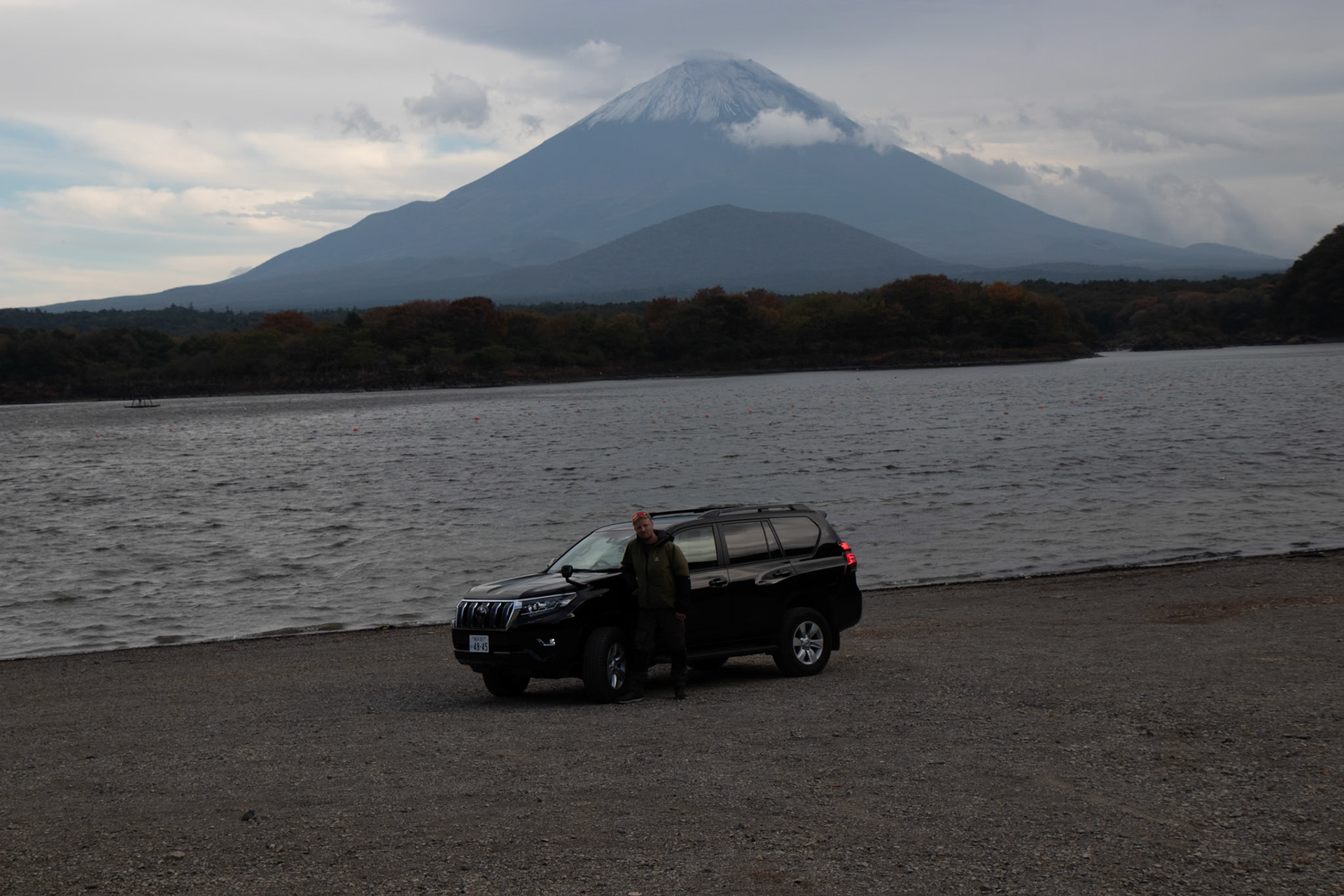 Me  in front of my rental Land Cruiser Prado in its natural habitat, Japan and Mt Fuji in the background.