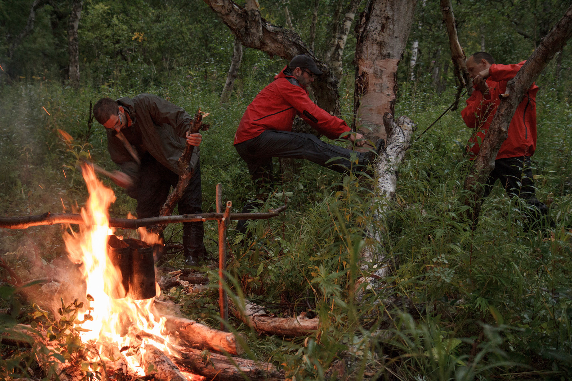 Cutting from wood by hand chain-saw and axe to cook our dinner