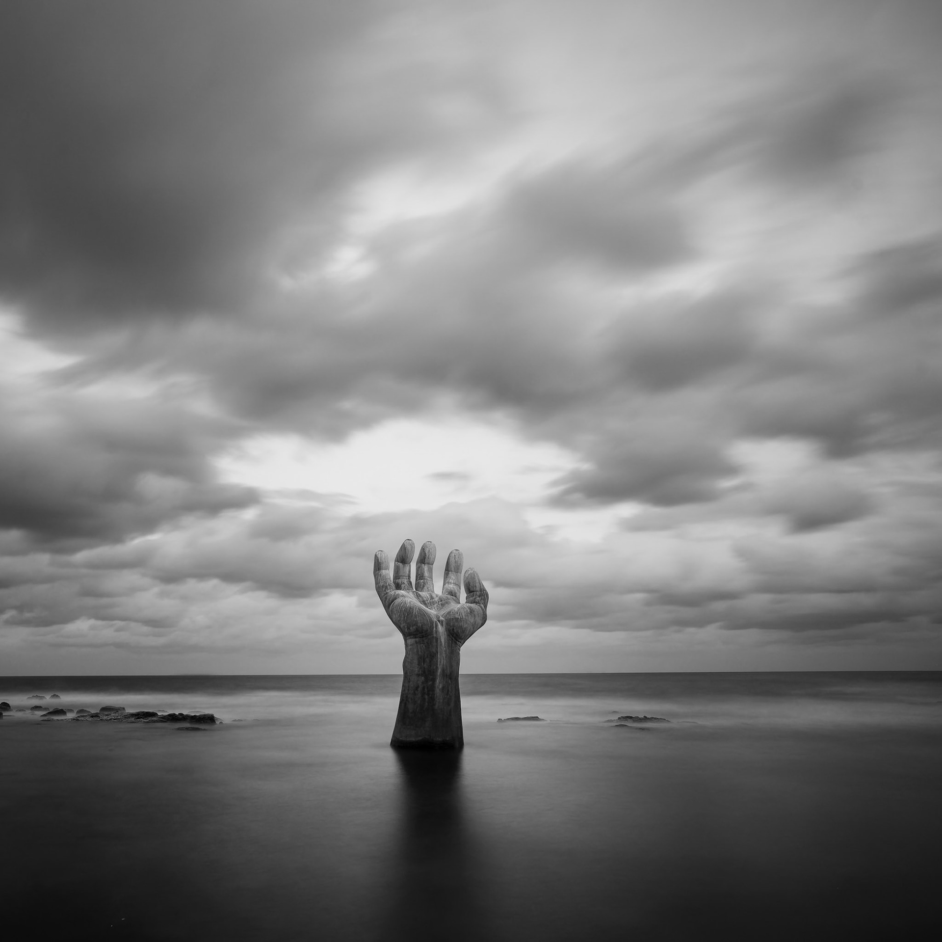 The hand is 8.5 m high and weighs 18 tons (상생의 손). It's located nearby a huge New Millennium Memorial Hall.