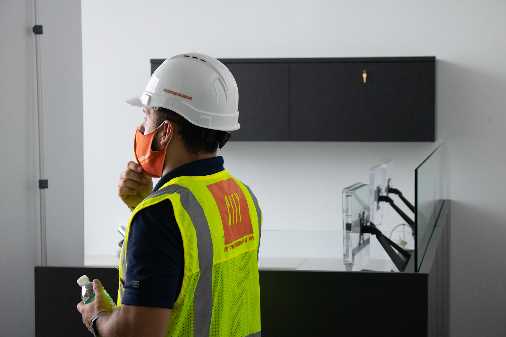 On-site Project Managers reviewing a build-out for the largest real-estate development company in Florida, The Related Group.