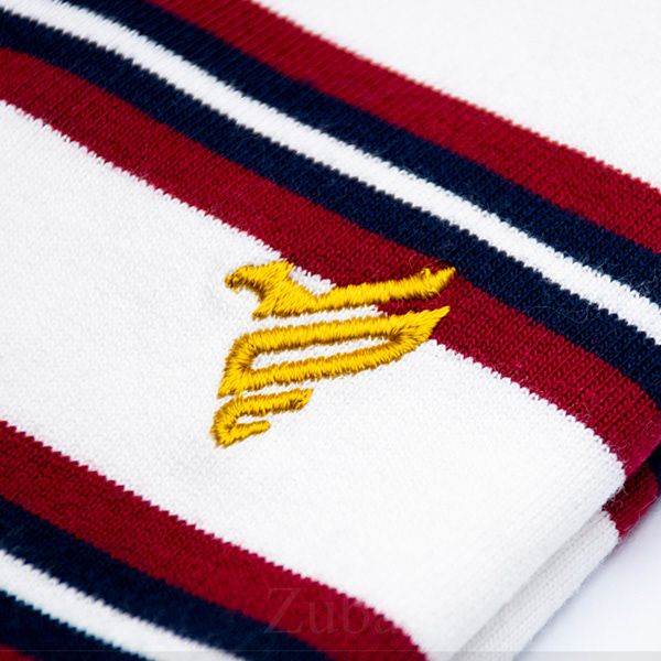 Branded polo shirt with 'Fitted' logo captured flat – high-quality product photography for fashion merchandising