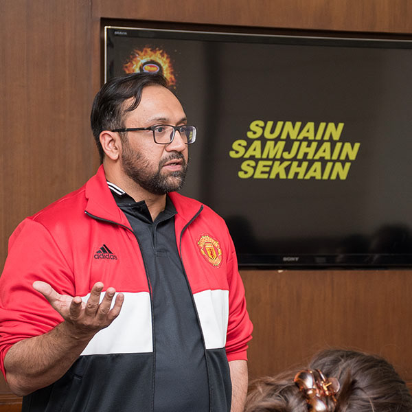 Corporate training session with speaker presenting in boardroom – formal business meeting coverage