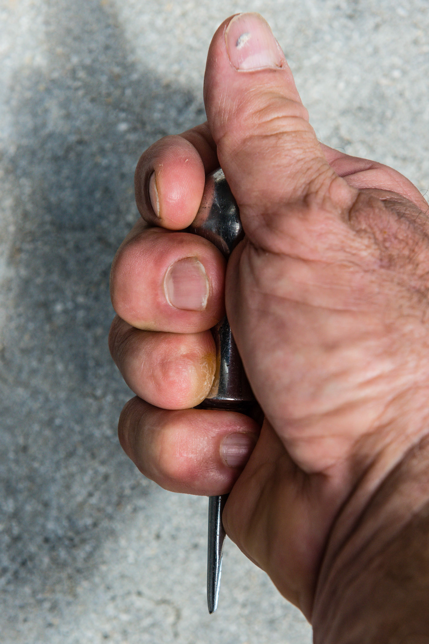 The thumb faces up and the elevator tip faces down. I rarely use this position because of lack of control and too much leverage pressure can be applied.