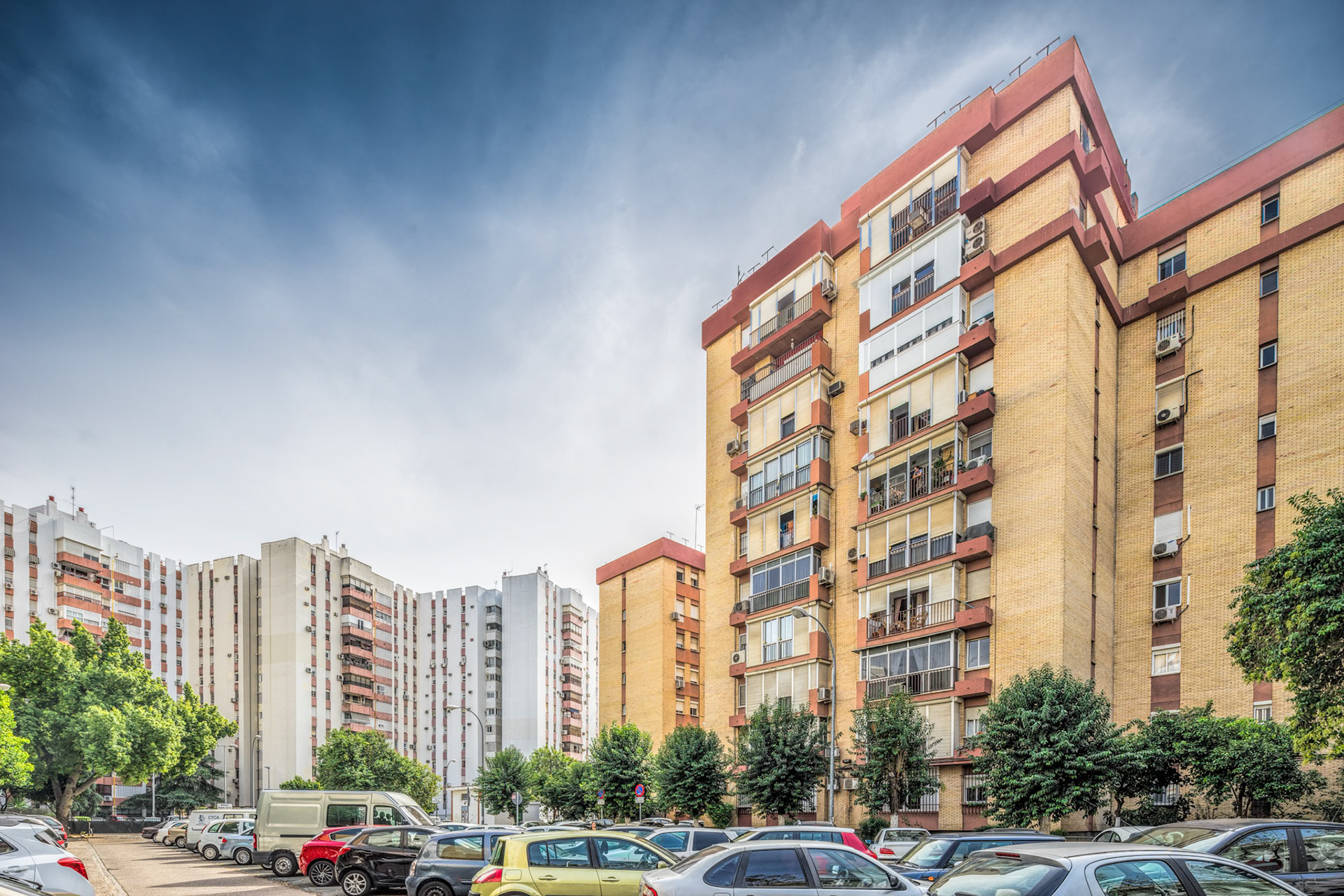 Urban architecture showcasing residential buildings in the historic Triana district of Seville.