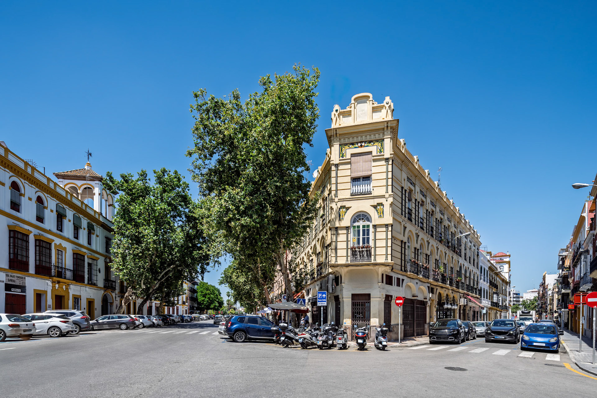 Building on Adriano Street—“Casa de las Moscas,” a 1914 work by Antonio Gómez Millán, with ceramic insects and wrought iron balconies on a triangular corner lot.