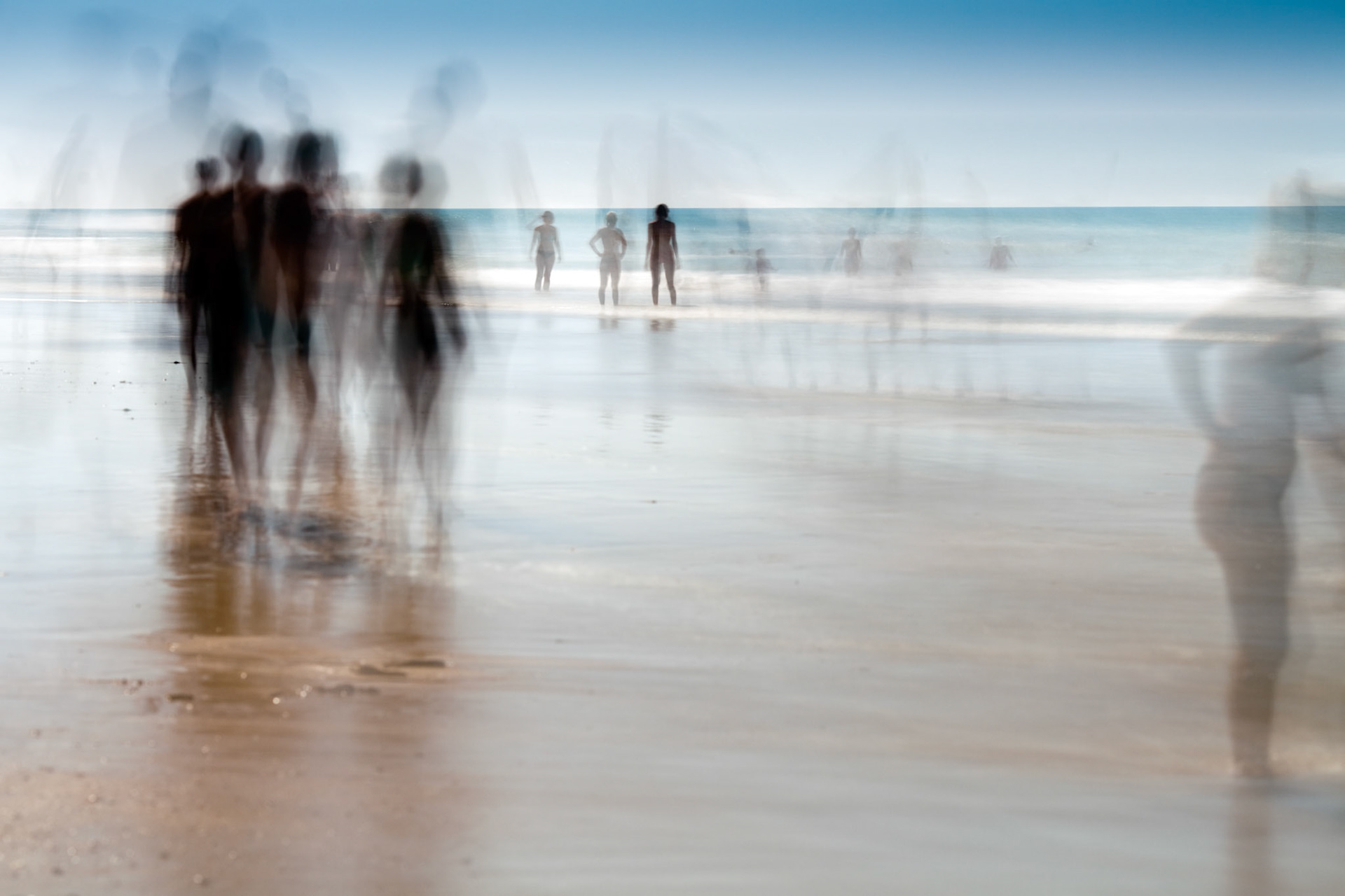 People on the beach. Daylight long exposure shot by the use of neutral density filters.