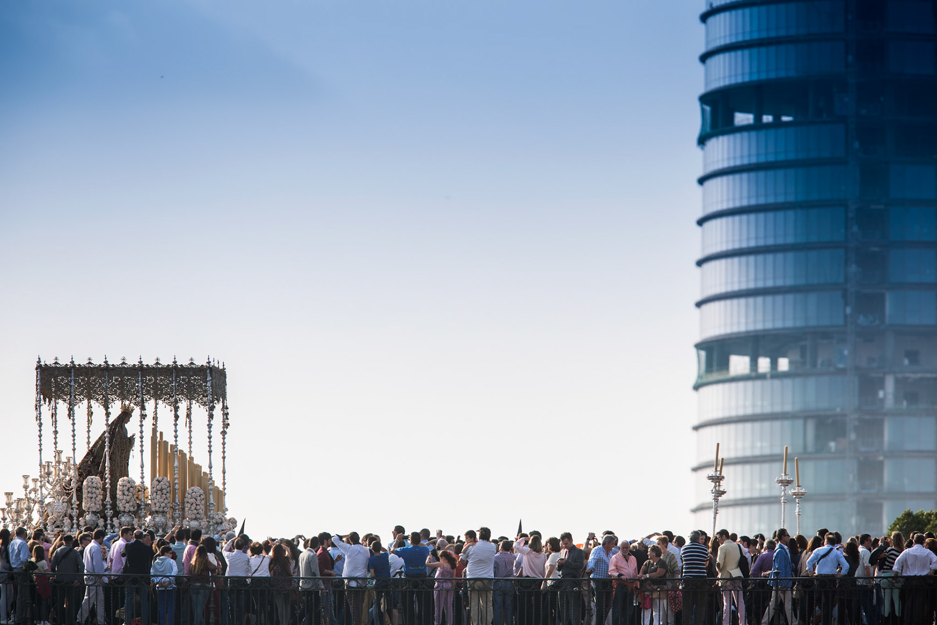 Holy Week float with the modern Pelli Tower skyscraper on the background