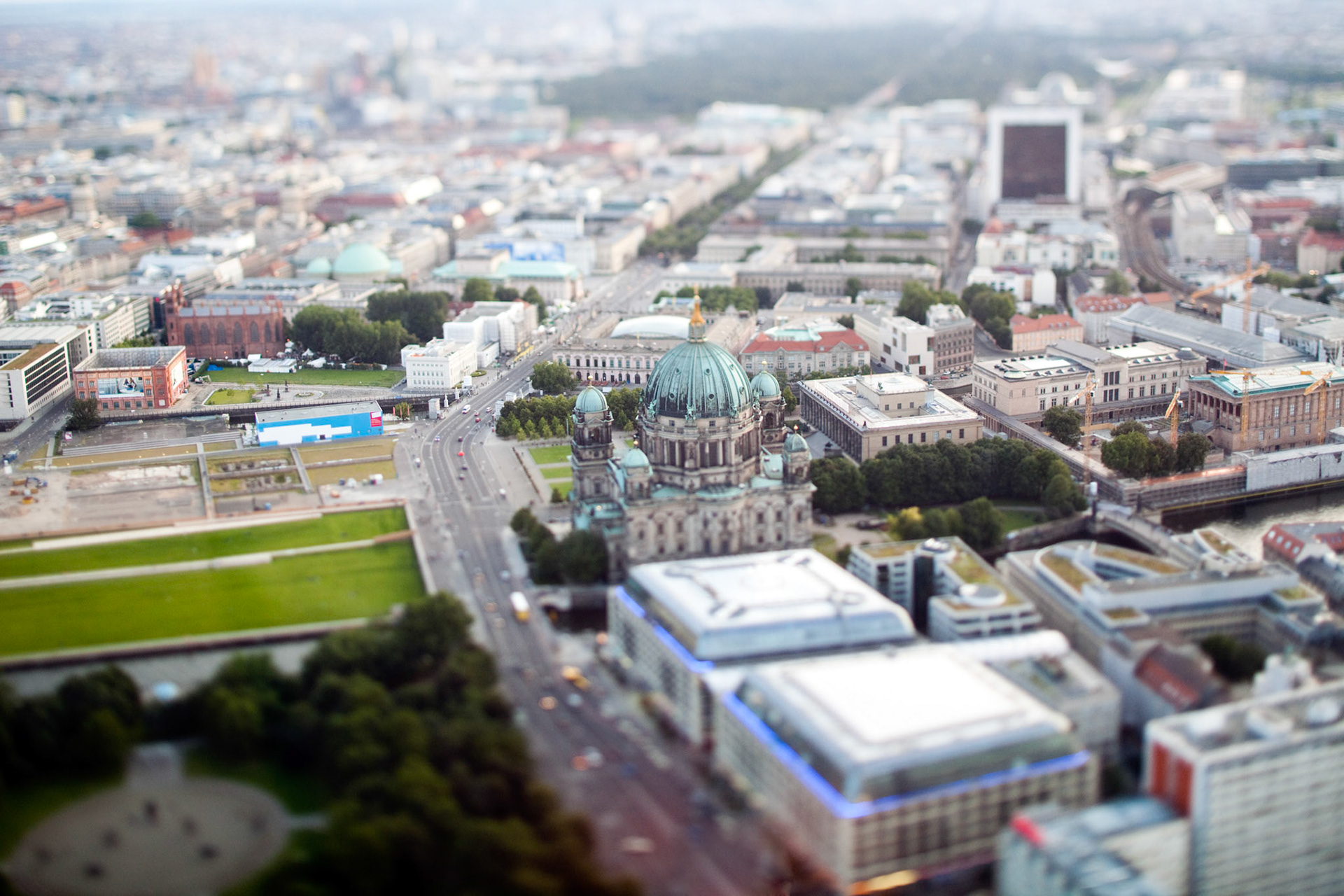 This aerial perspective showcases the Berliner Cathedral and the vibrant Unter den Linden area, capturing a unique miniaturization effect.