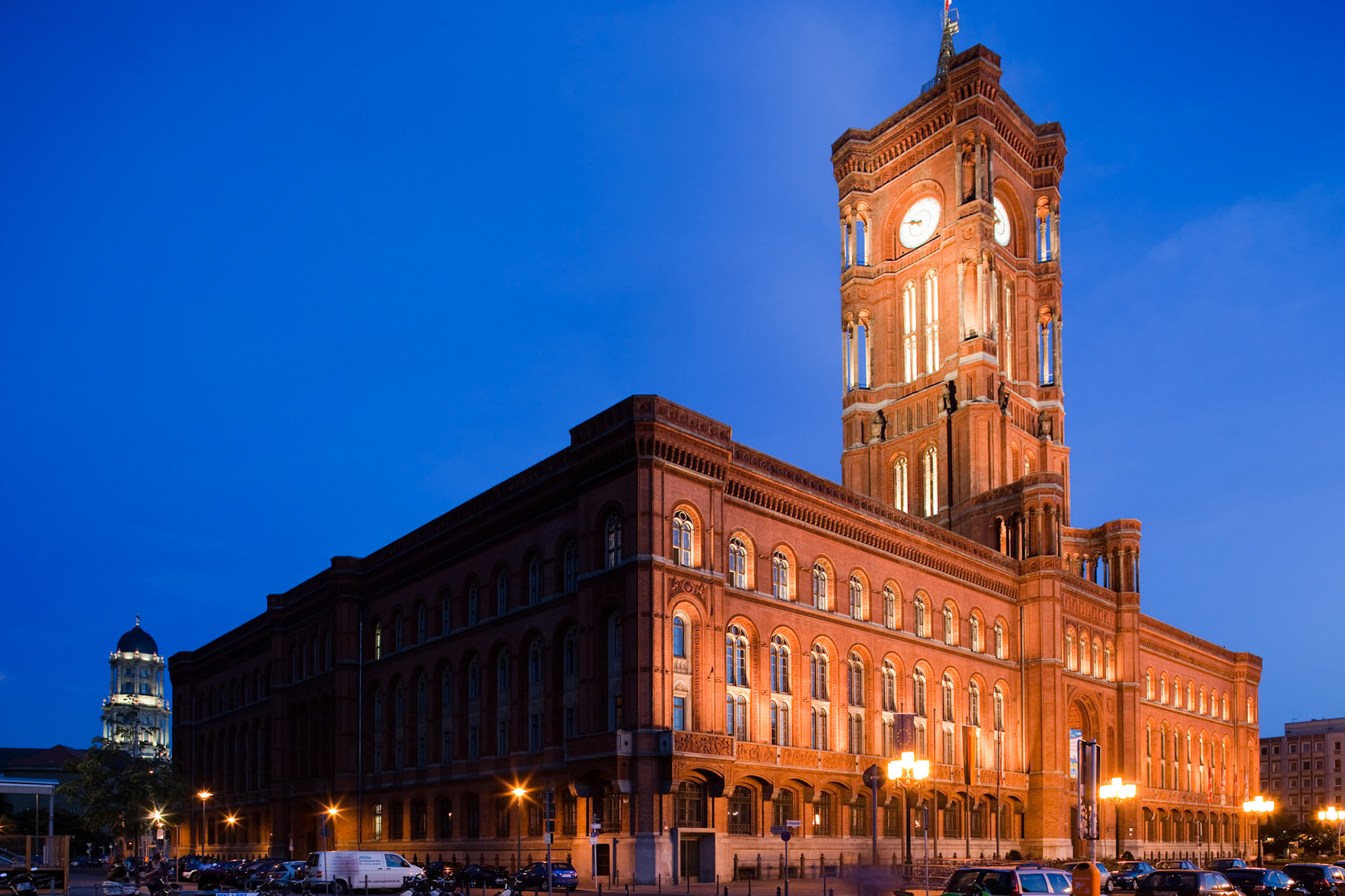 The Red City Hall of Berlin glows beautifully at dusk, highlighting its impressive architecture and historical significance.