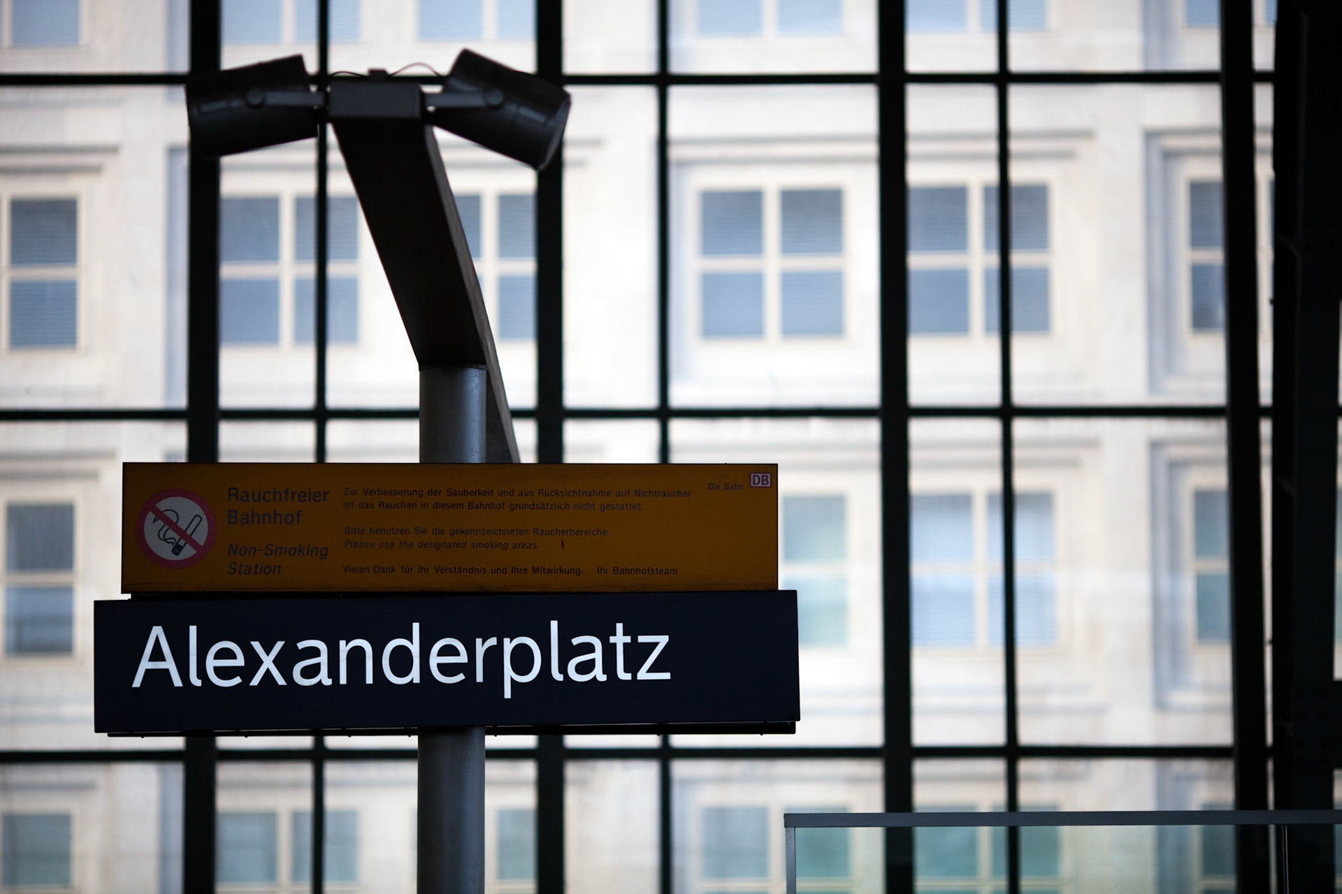 The sign for Alexanderplatz railway station is prominently displayed, showcasing an important transport hub in Berlin\'s Mitte district.