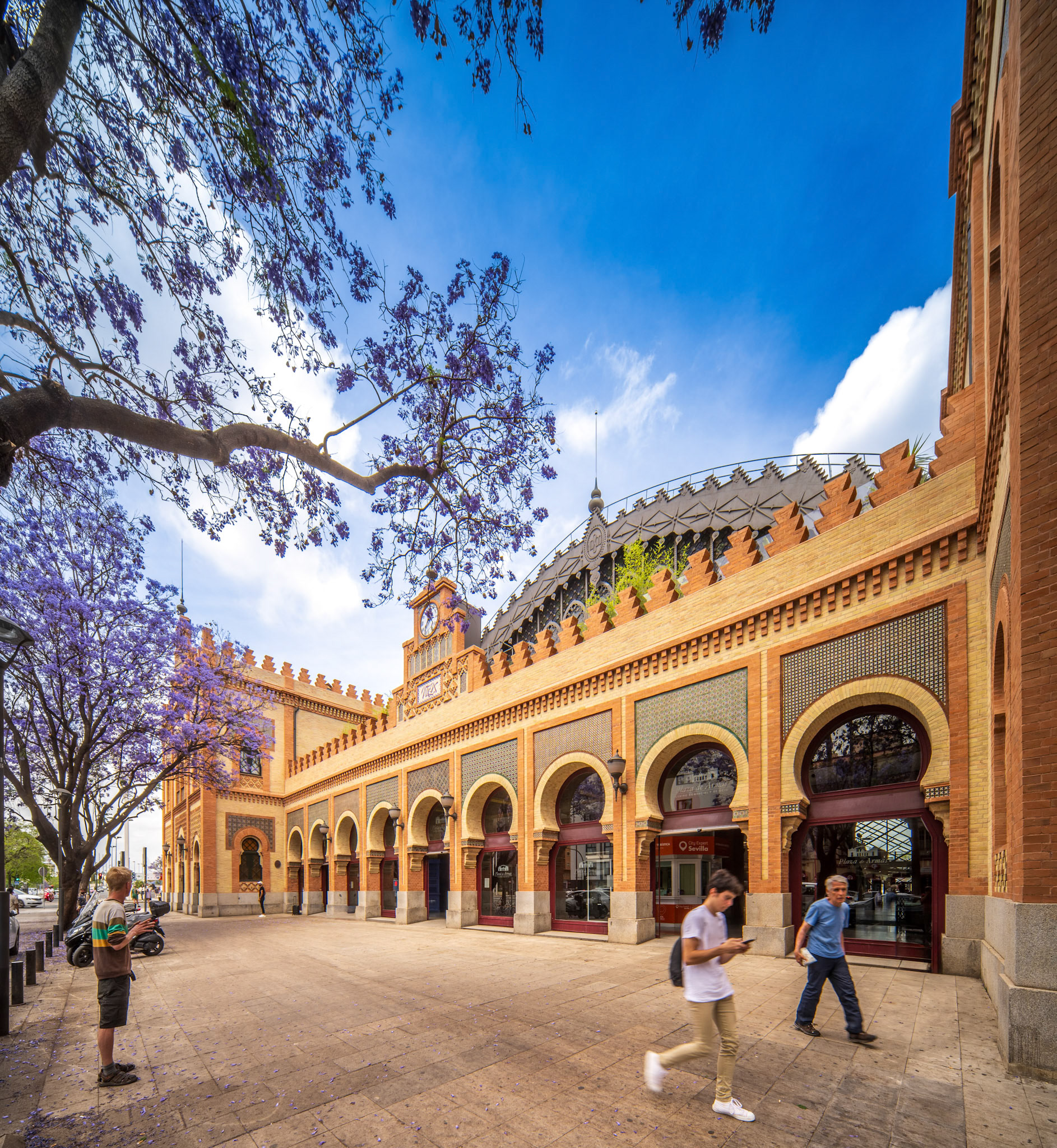 Seville, Spain, May 15 2022, Neo-Mudejar styled building with characteristic arches in Seville's historic Plaza de Armas area.
