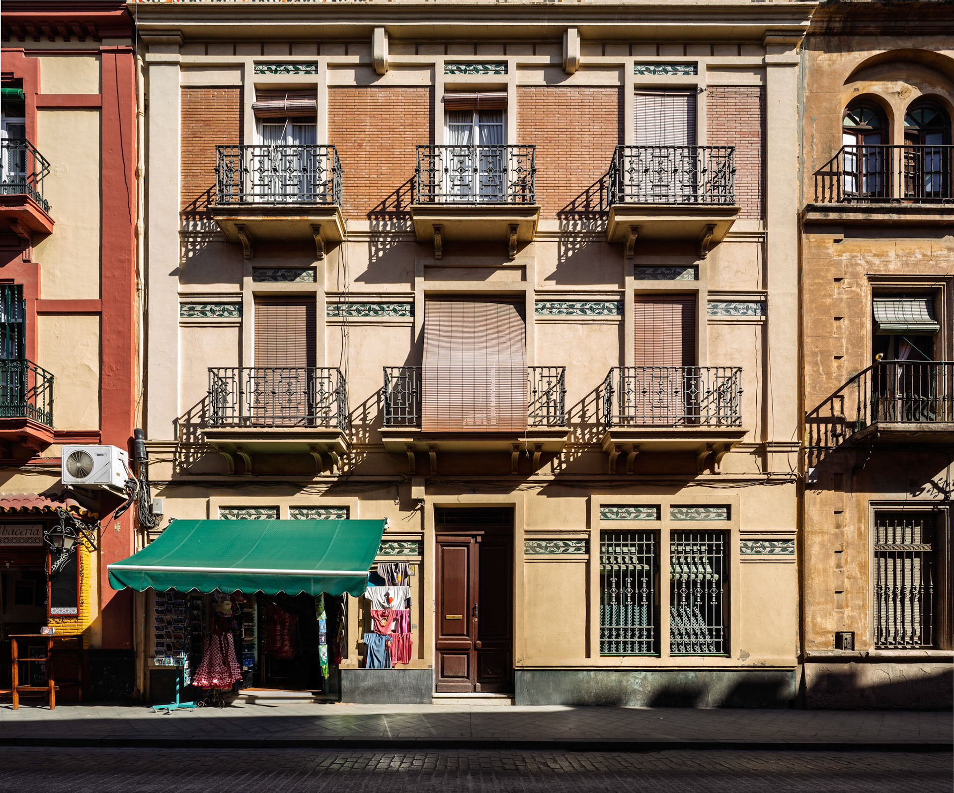 Modernist house, designed by Jose Gomez Millan in 1913, showcases unique architectural features in Seville's Arenal neighborhood.