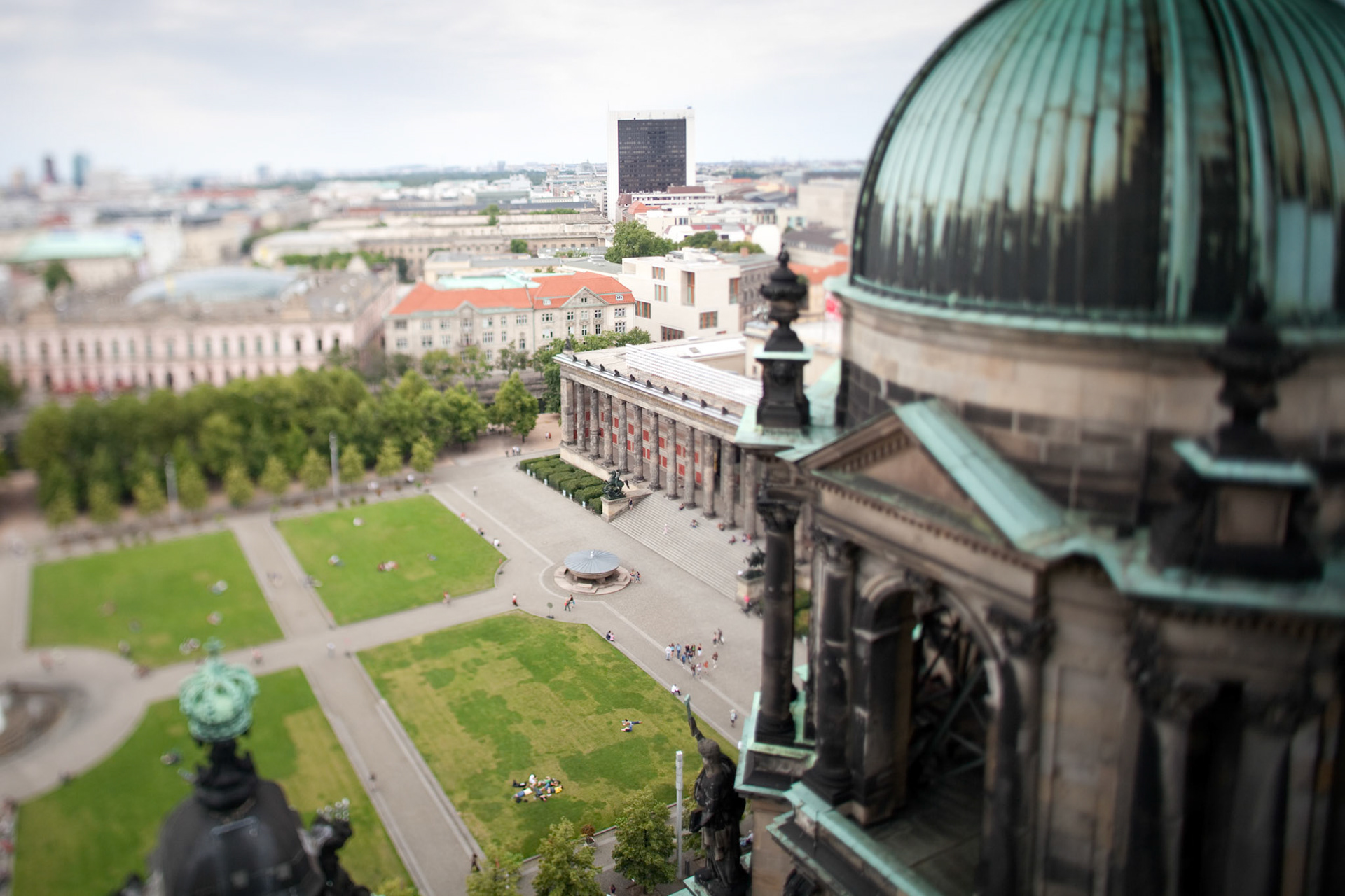 Capturing the lush green expanse of Lustgarten from the dome, showcasing Berlin\'s architectural beauty.