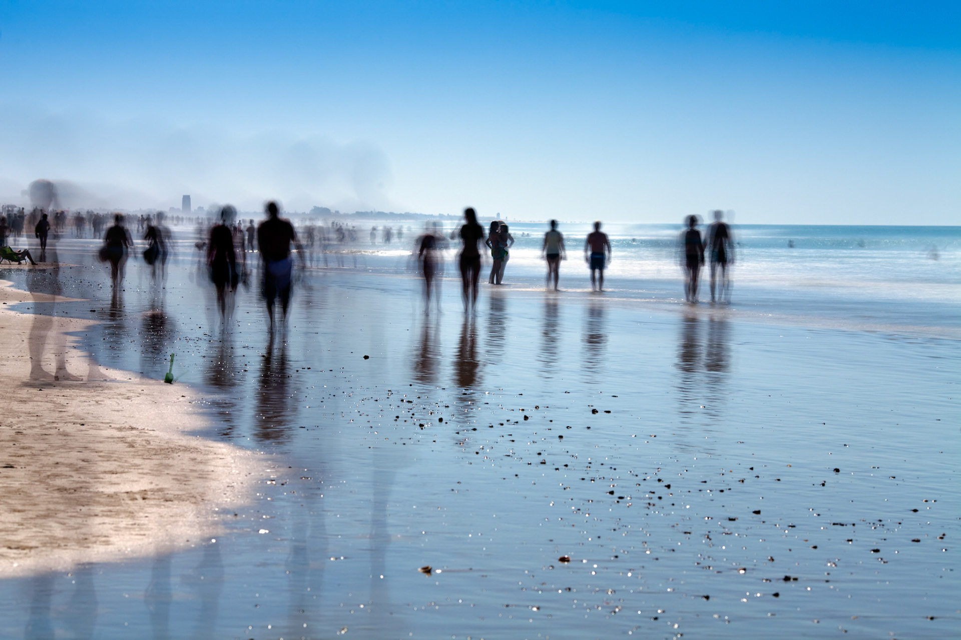 People on the beach. Daylight long exposure shot by the use of neutral density filters.