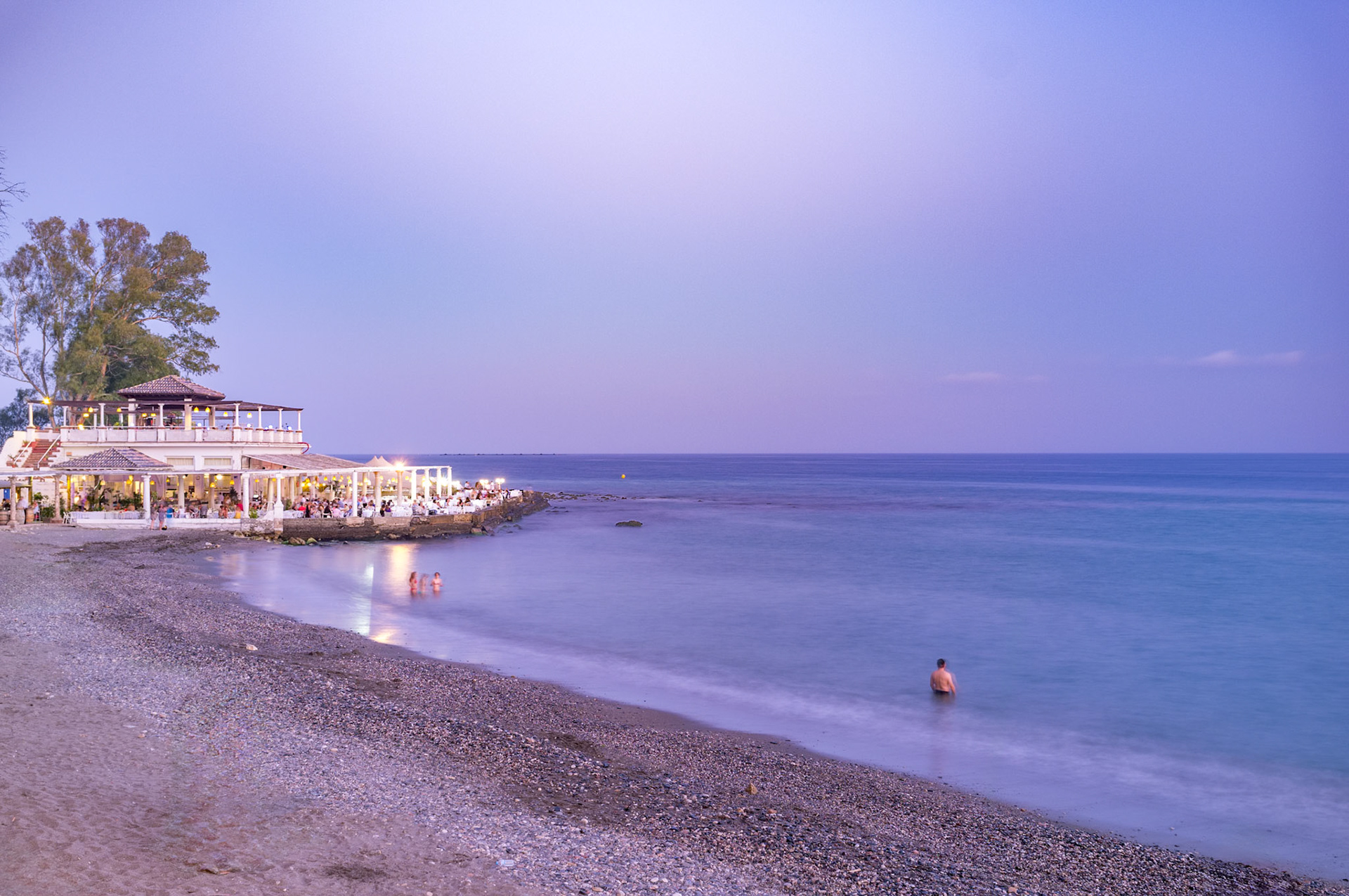 Serene long exposure photo of Playa de los Banos del Carmen in Malaga, capturing the tranquil evening ambiance along the beautiful Andalusian coastline.