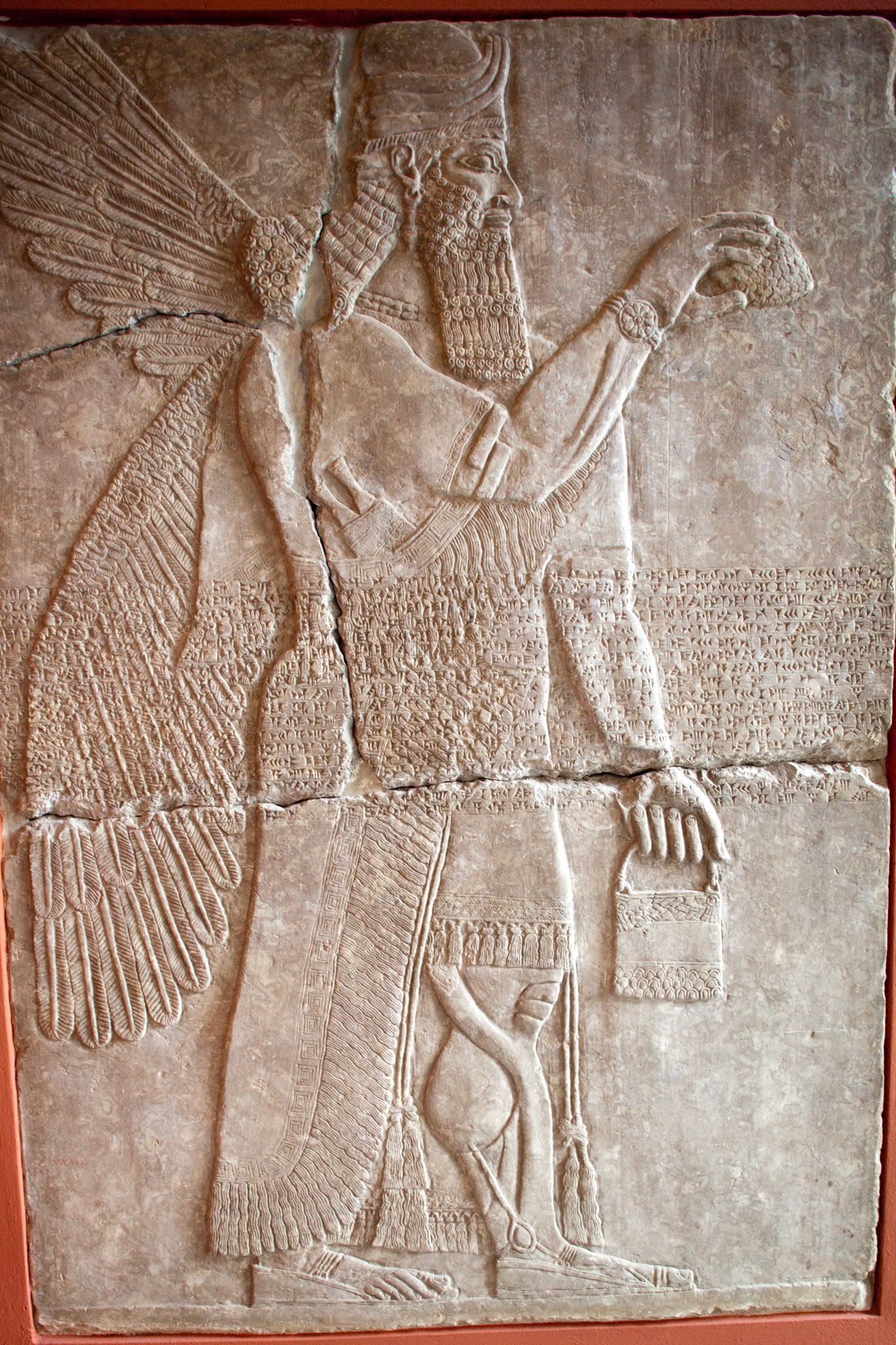 Berlin, Germany, July 24 2009, Visitors admire intricate Assyrian alabaster reliefs depicting winged divine beings at the Pergamon Museum in Berlin, Germany.