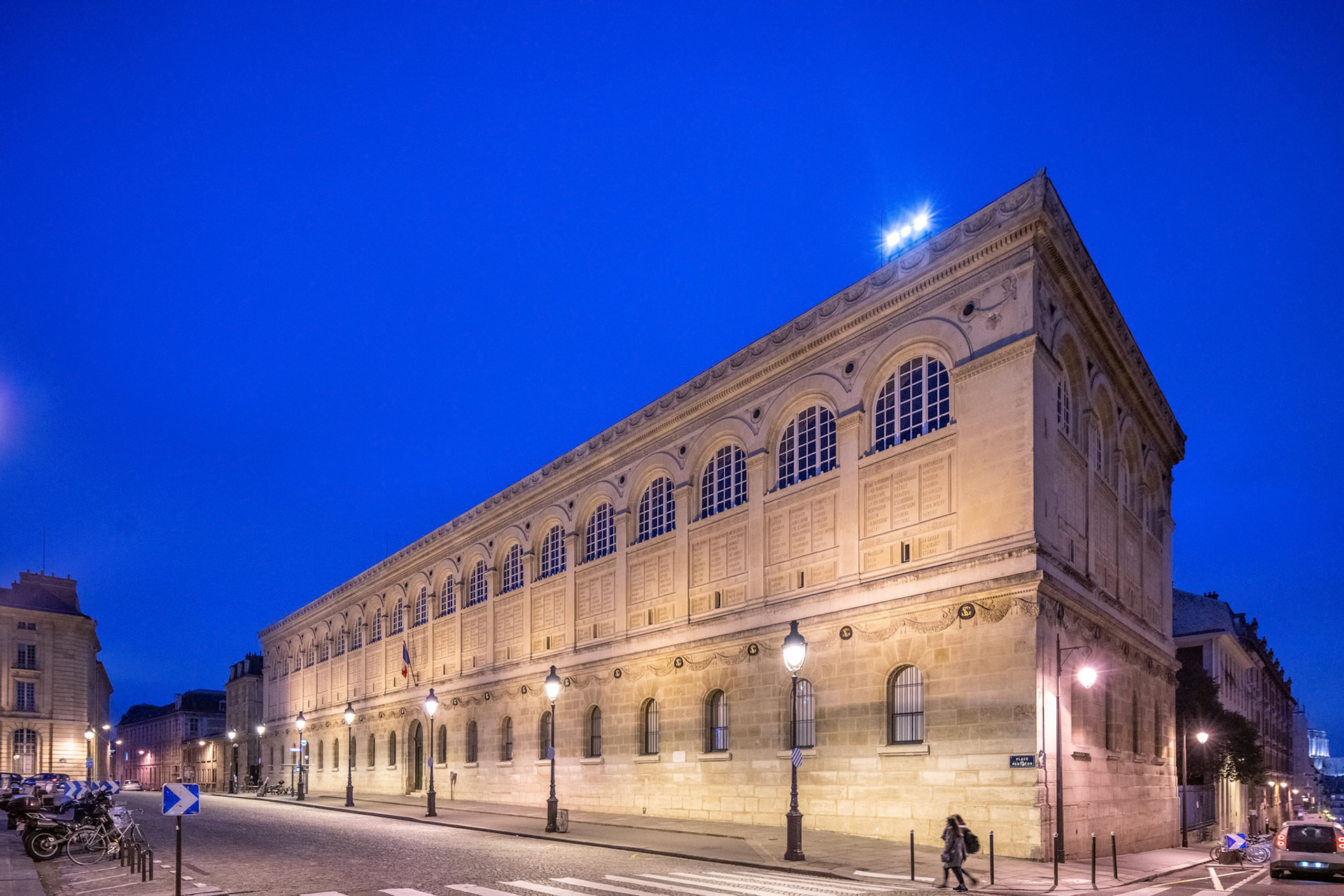 Dusk falls on the historic Sainte-Genevieve Library, with streetlights aglow.