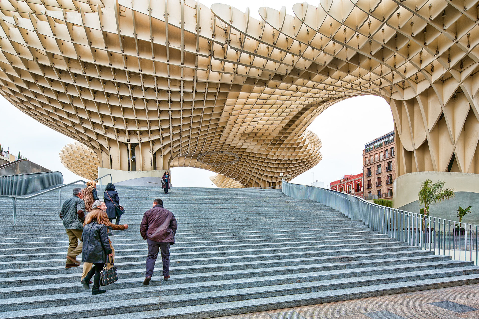 Seville, Spain, Jan 12 2014, A group of people walking on stairs below the iconic Las Setas structure in Seville.