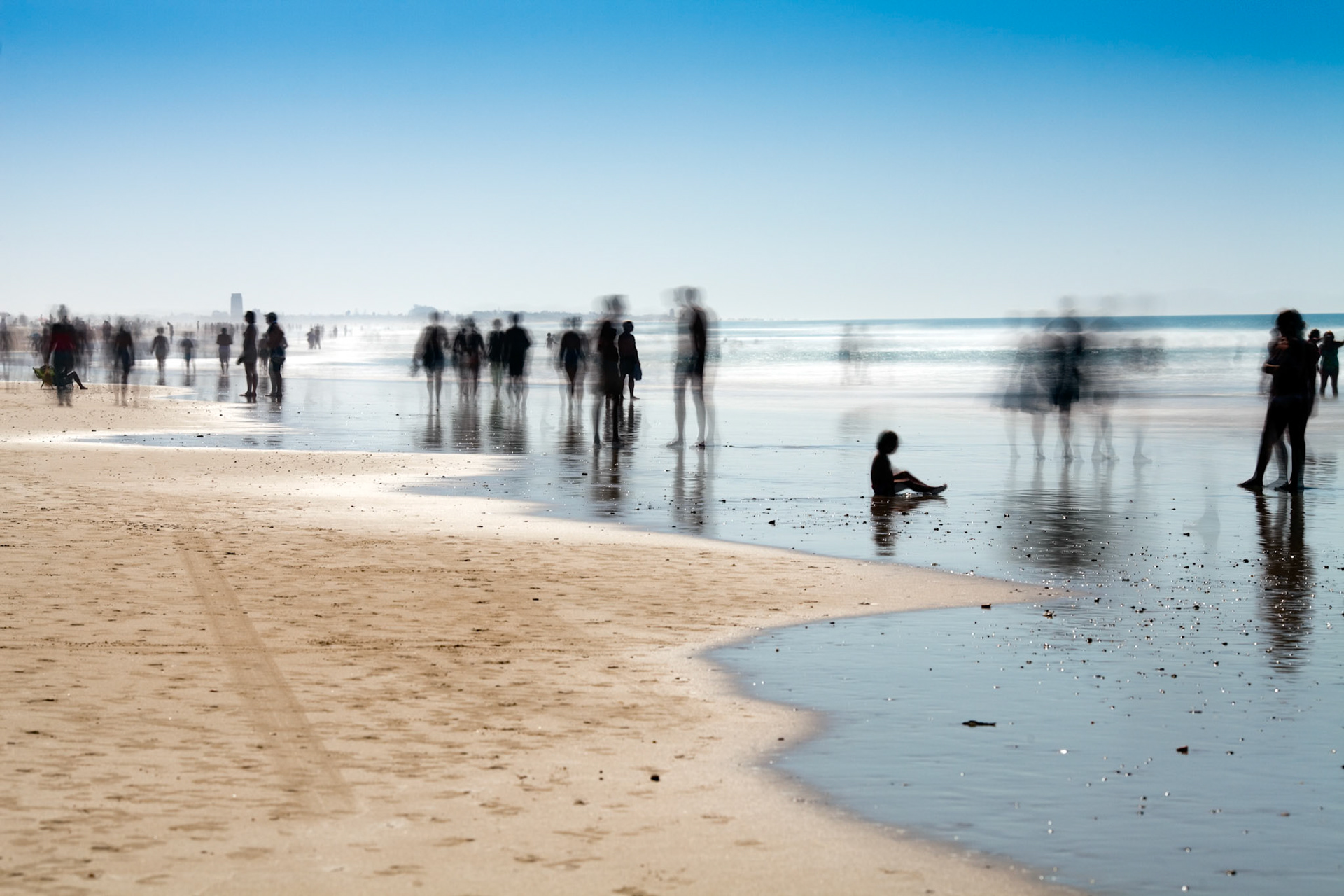 People on the beach. Daylight long exposure shot by the use of neutral density filters.