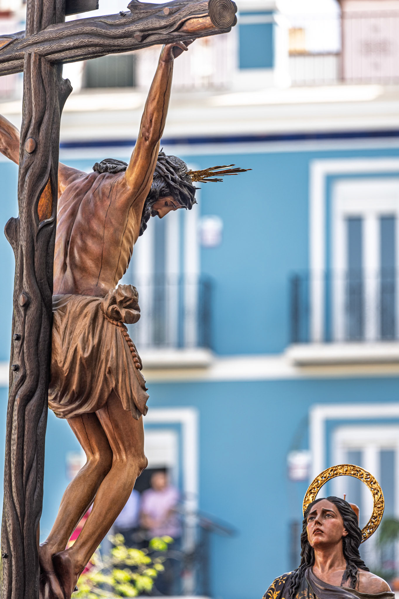 Christ of Buena Muerte (Good Death) and Mary Magdalene on the Hiniesta mystery float during Palm Sunday Holy Week procession in Seville, Andalusia, Spain.