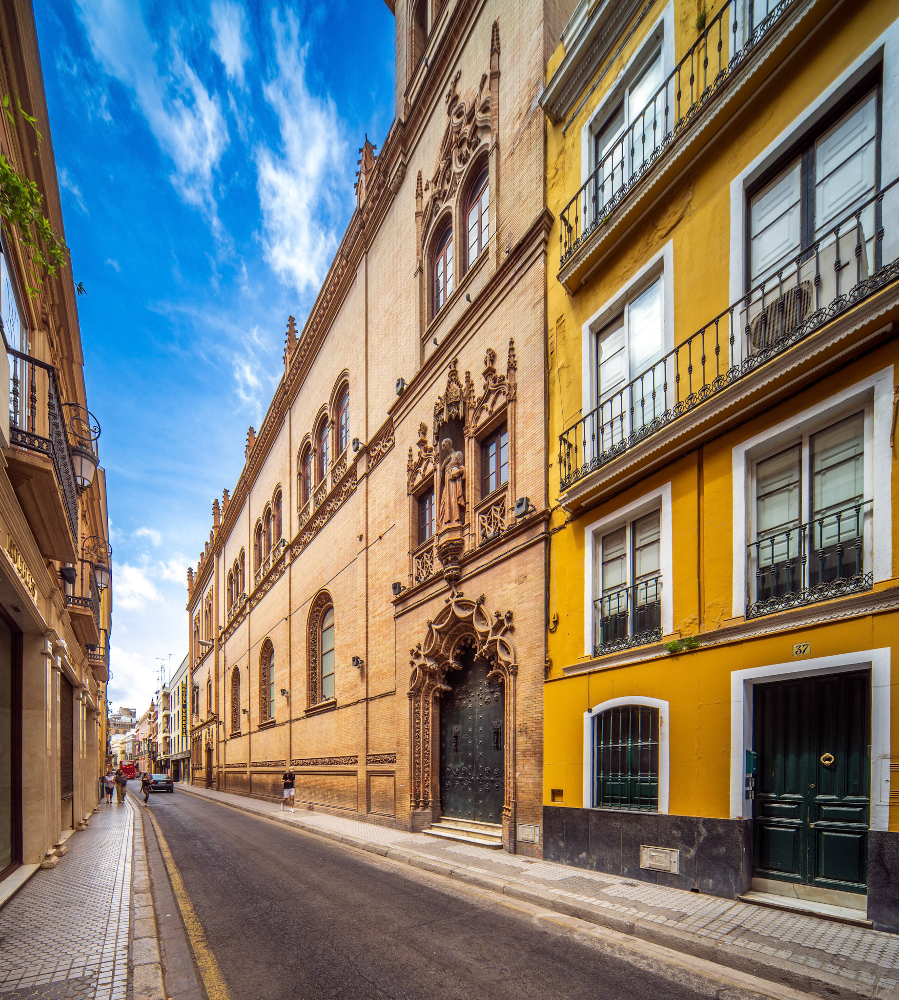 Beautiful street showcasing historic architecture of Capilla de los Luises in Seville.
