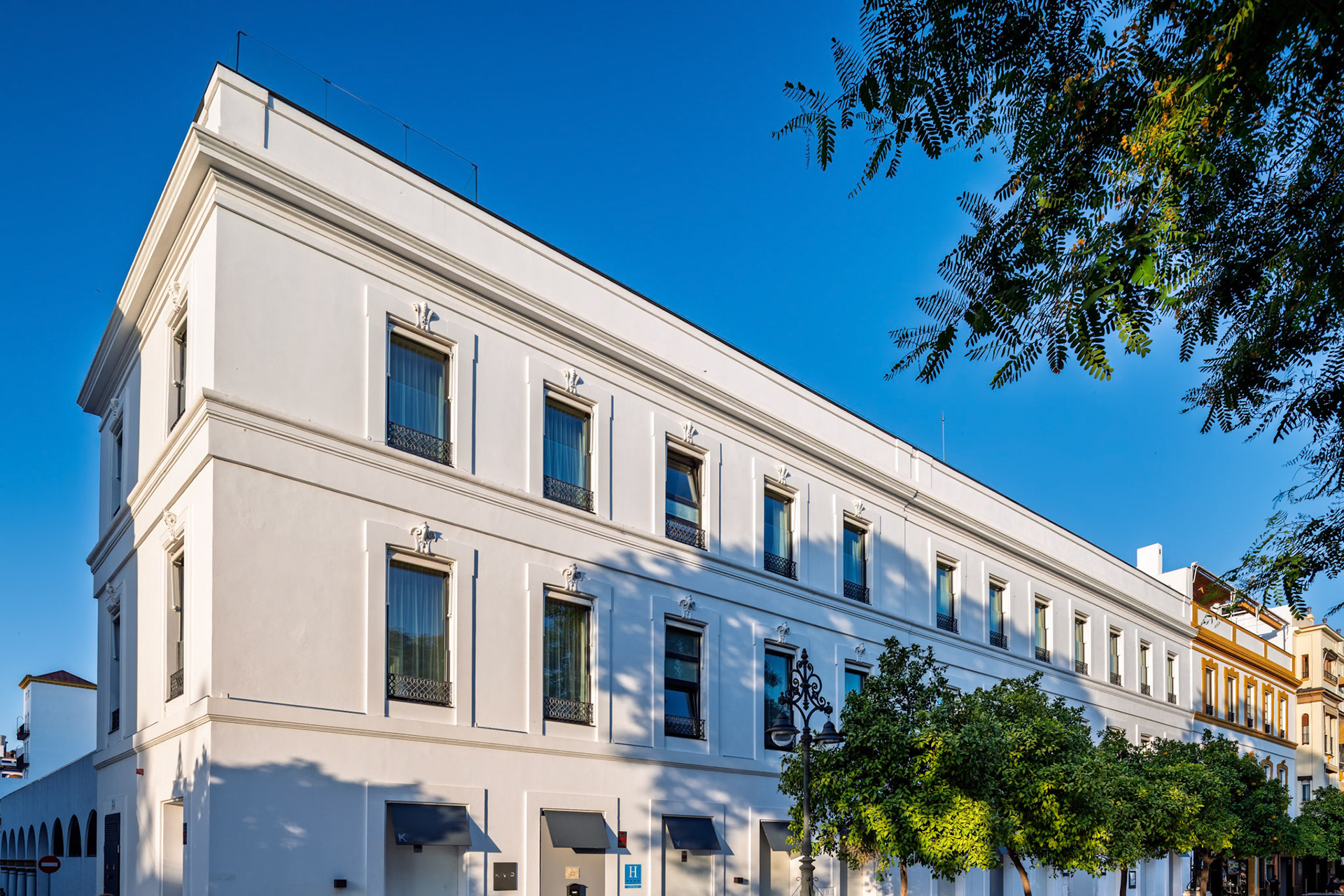 Hotel Kivir on Paseo de Colón—early 20th-century building restored by Cruz y Ortiz, blending historic elegance with contemporary Sevillian minimalism