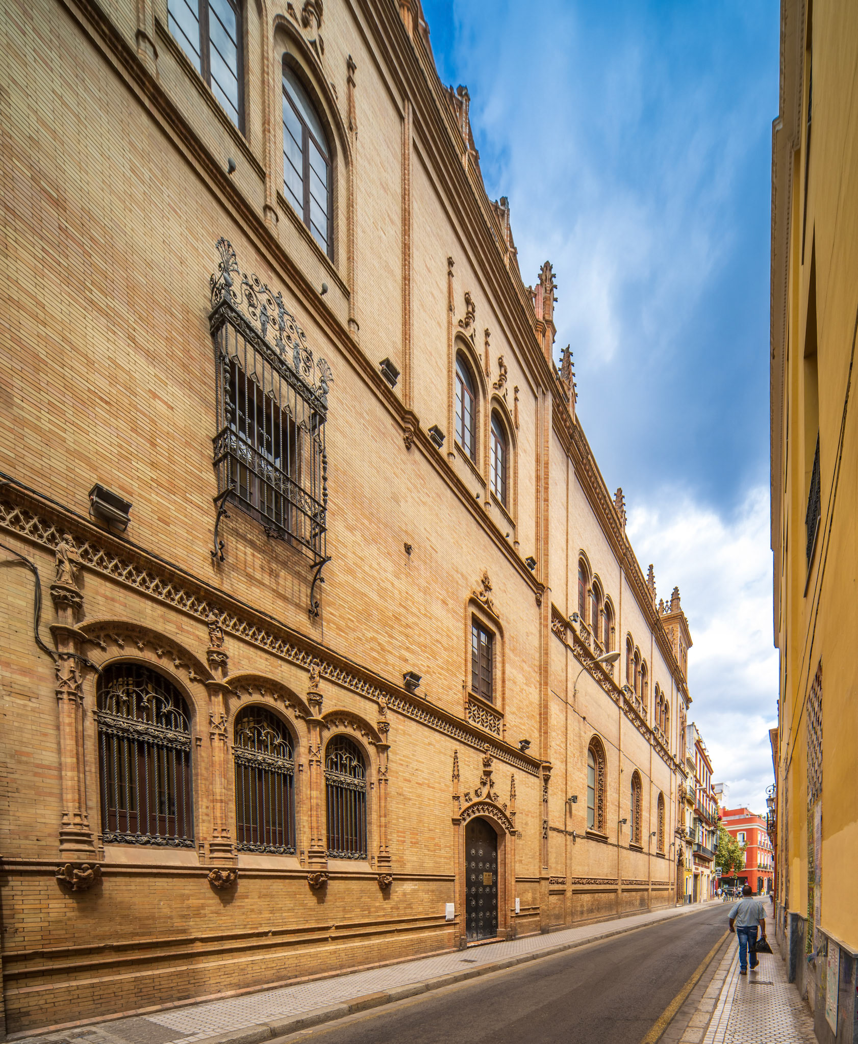 Beautiful street showcasing historic architecture of Capilla de los Luises in Seville.