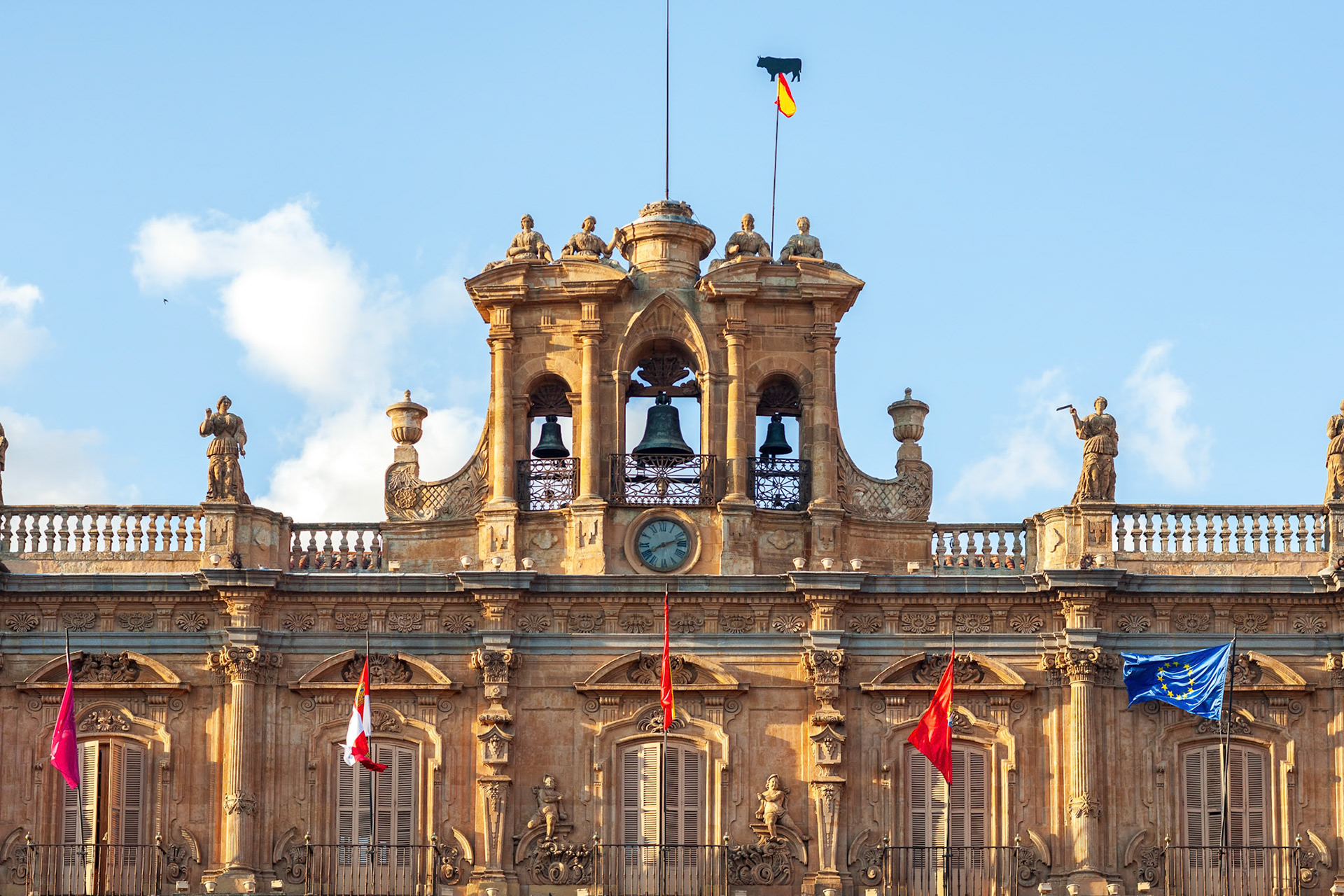 Architectural detail of the Town Hall in Salamanca, Spain, with clear blue sky.
