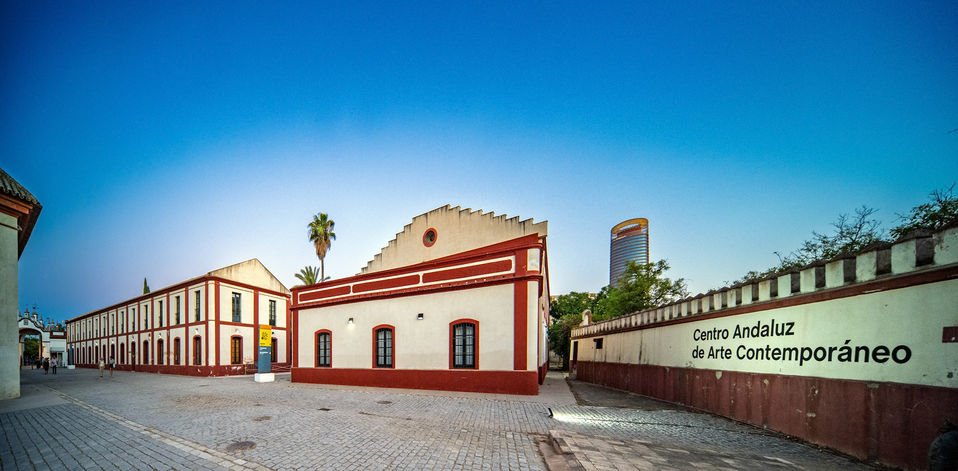 Seville, Spain, July 26 2022, Visitors walk through the tranquil courtyard of the CAAC, a former convent showcasing contemporary art in Isla de la Cartuja, Seville.