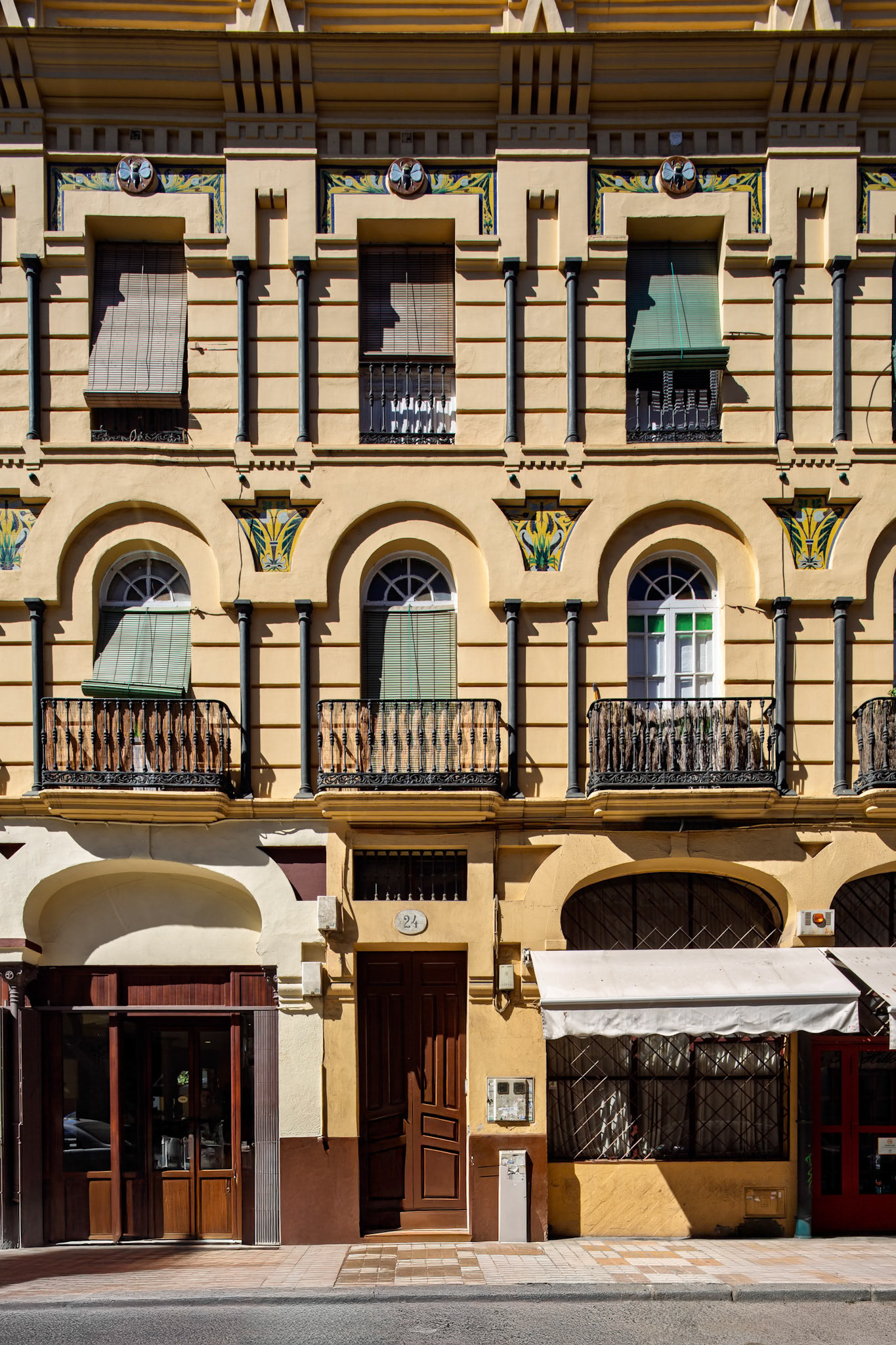 Explore La Casa de las Moscas, a unique triangular building in Seville adorned with intricate insect designs from 1914.