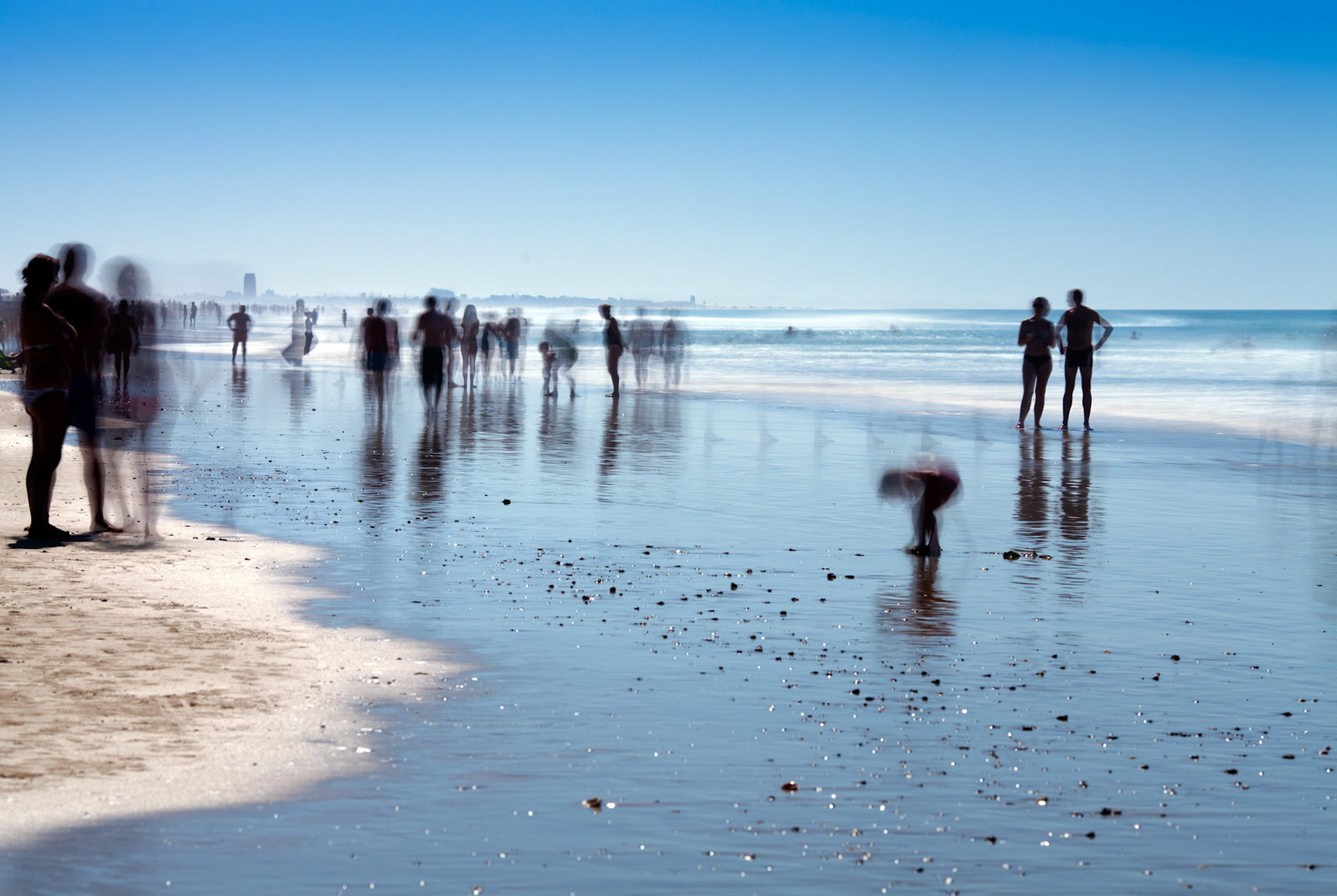 People on the beach. Daylight long exposure shot by the use of neutral density filters.