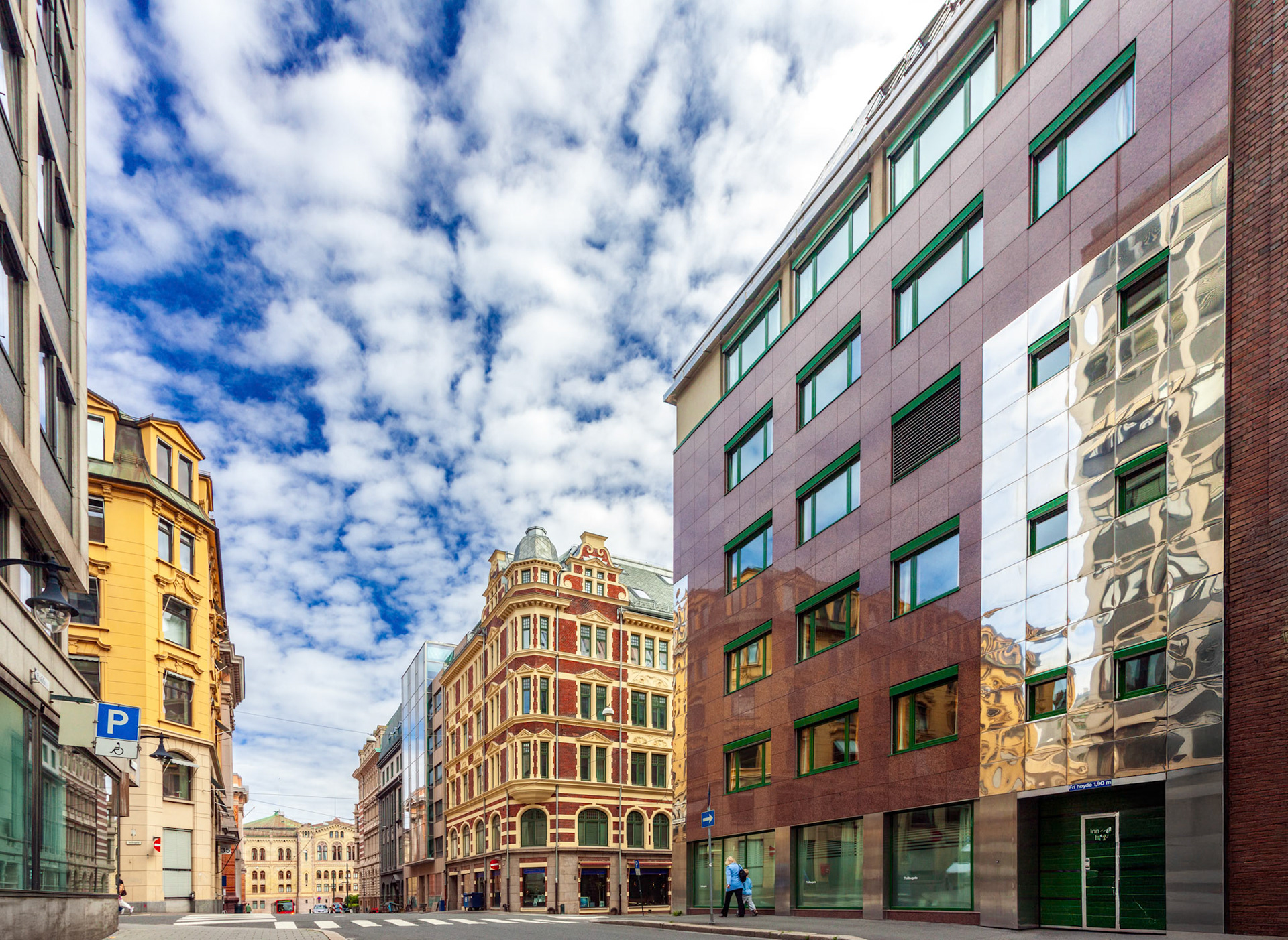 Two distinct architectural styles are visible in Tollbugata, Oslo.