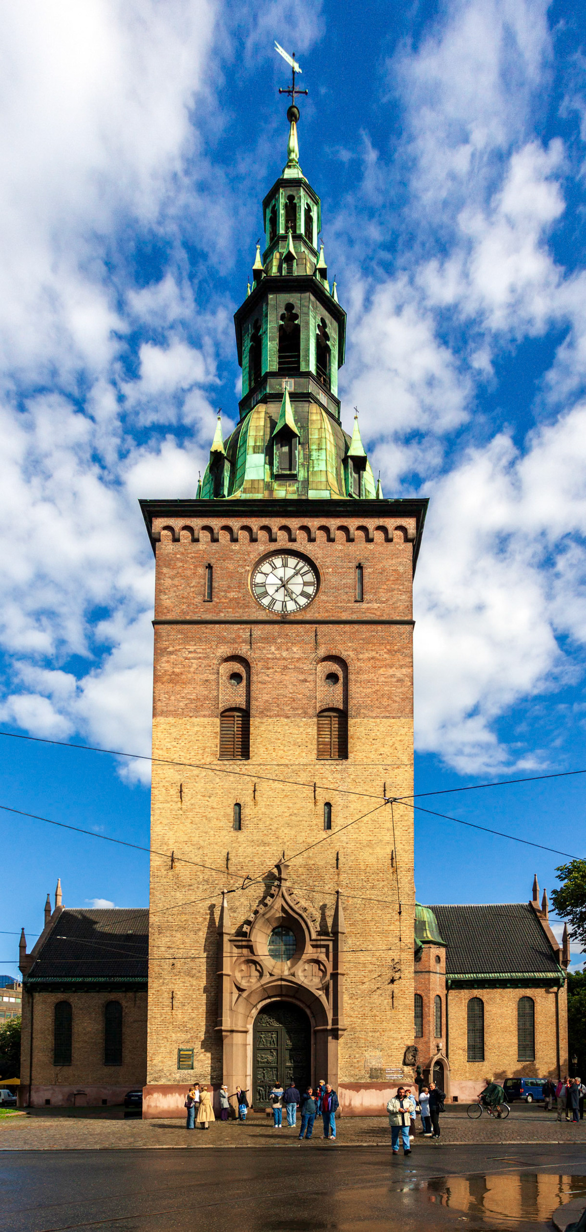 Oslo, Norway, Aug 10 2017, The Bell Tower of Oslo Cathedral showcases its striking architecture under the vibrant blue sky with scattered clouds.