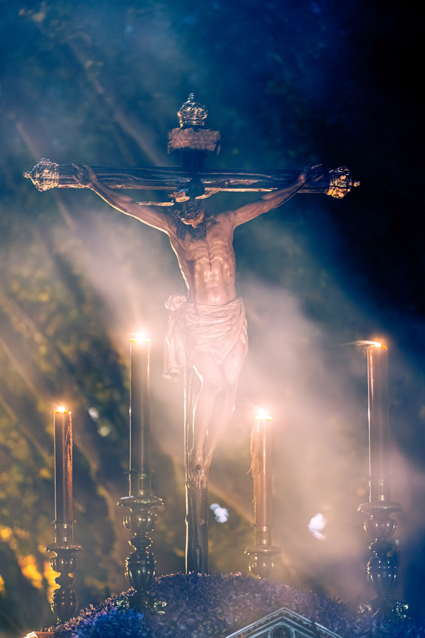 The 16th century Christ of Burgos statue enveloped in a cloud of incense during Holy Wednesday night. A solemn moment from Holy Week in Seville, Andalusia, Spain.