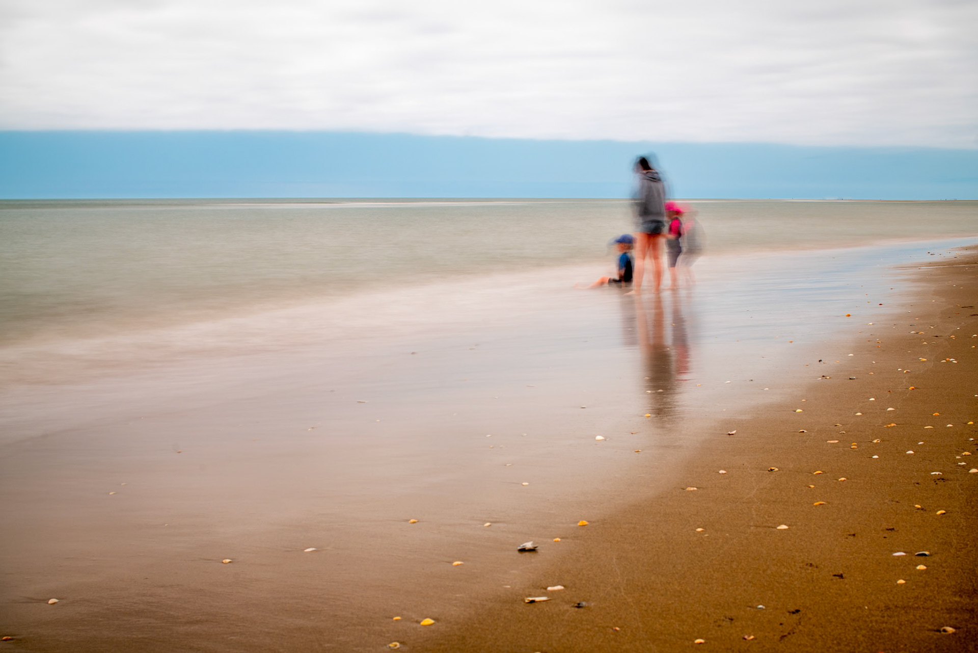 Kids on the beach, long exposure shot.