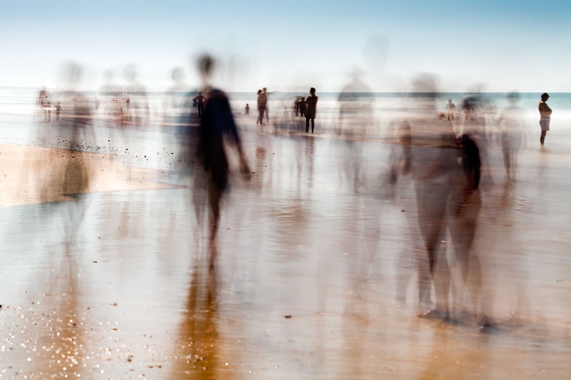 People on the beach. Daylight long exposure shot by the use of neutral density filters.