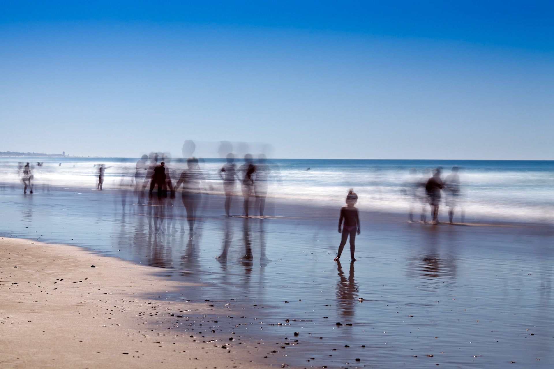 People on the beach. Daylight long exposure shot by the use of neutral density filters.