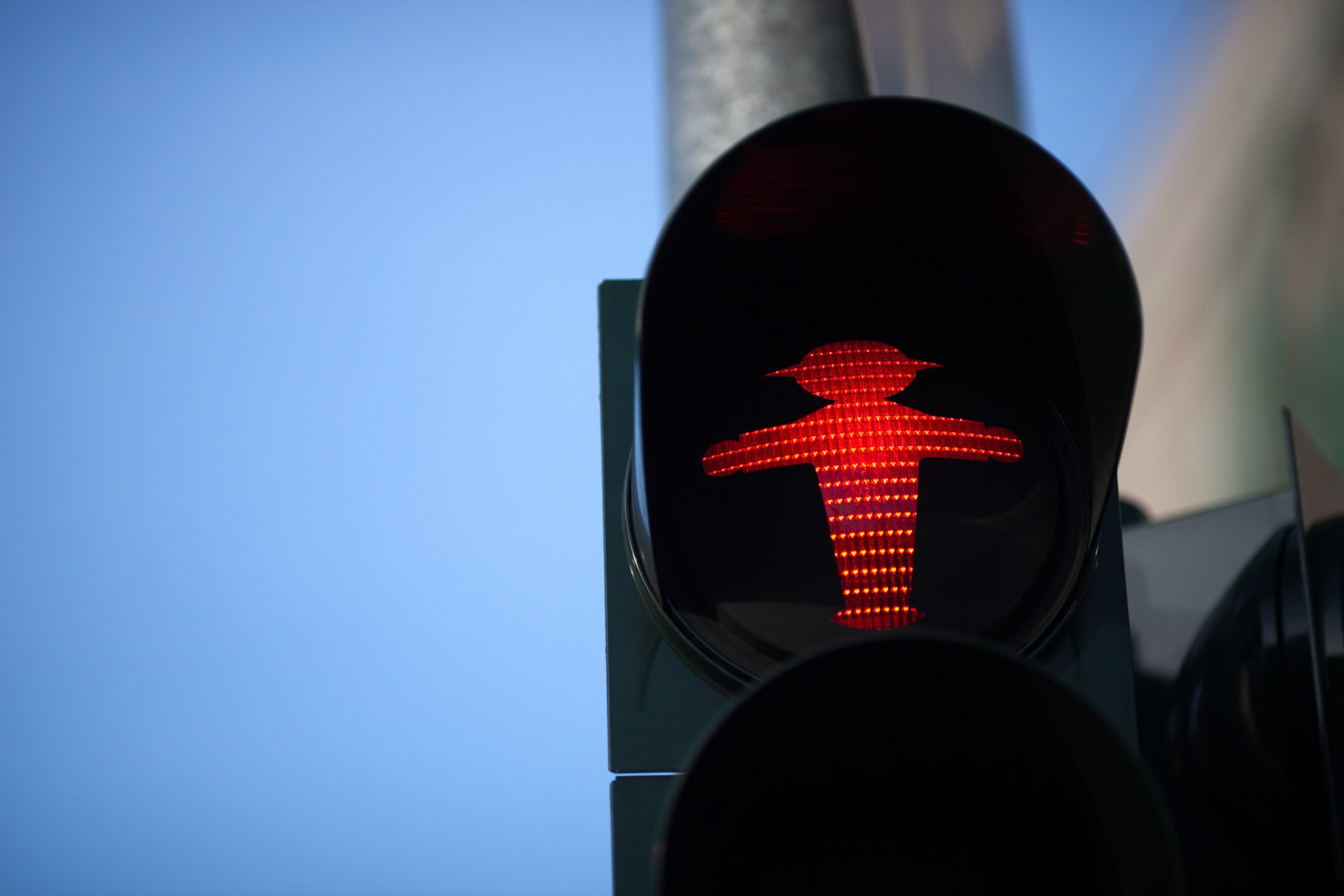 The iconic Ampelmännchen shows a red signal, urging pedestrians to stop in East Berlin.