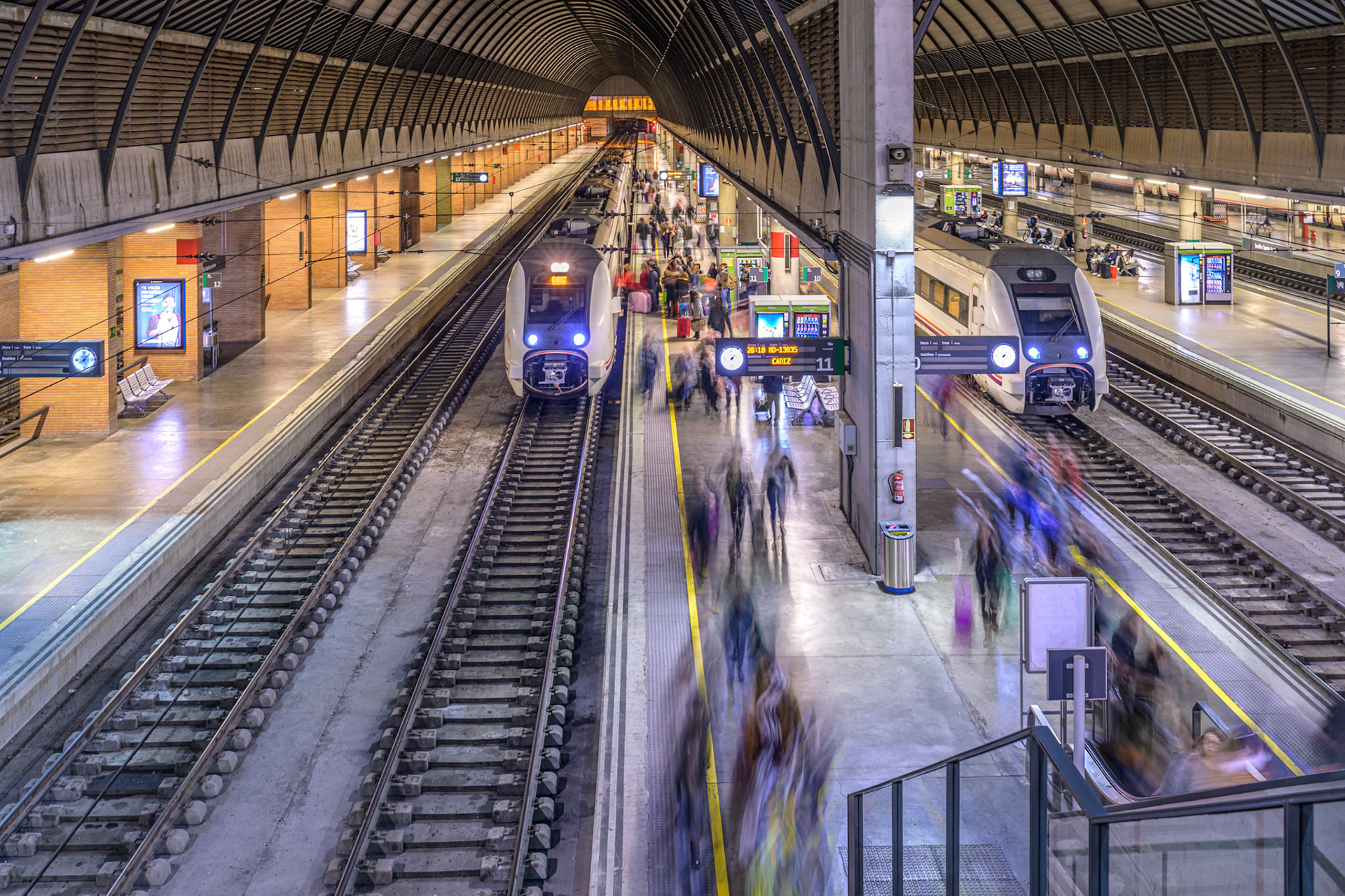 Seville, Spain, Jan 26 2020, Travelers are disembarking from trains at Santa Justa station, capturing dynamic movement and energy in Seville's bustling transport hub.