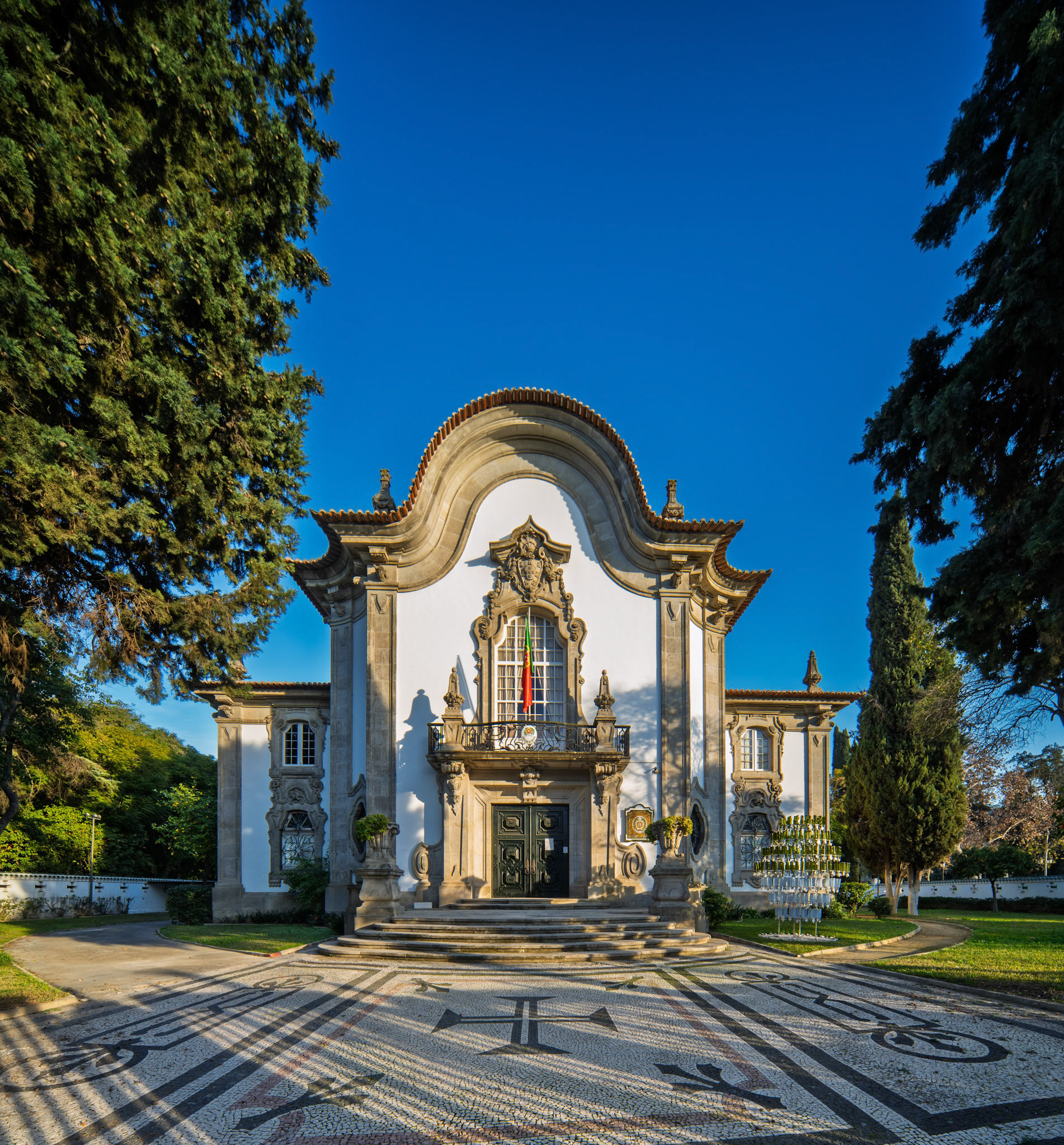 Pabellon de Portugal features impressive neobaroque architecture in Seville, reflecting its history from the 1929 Ibero-American Exposition.