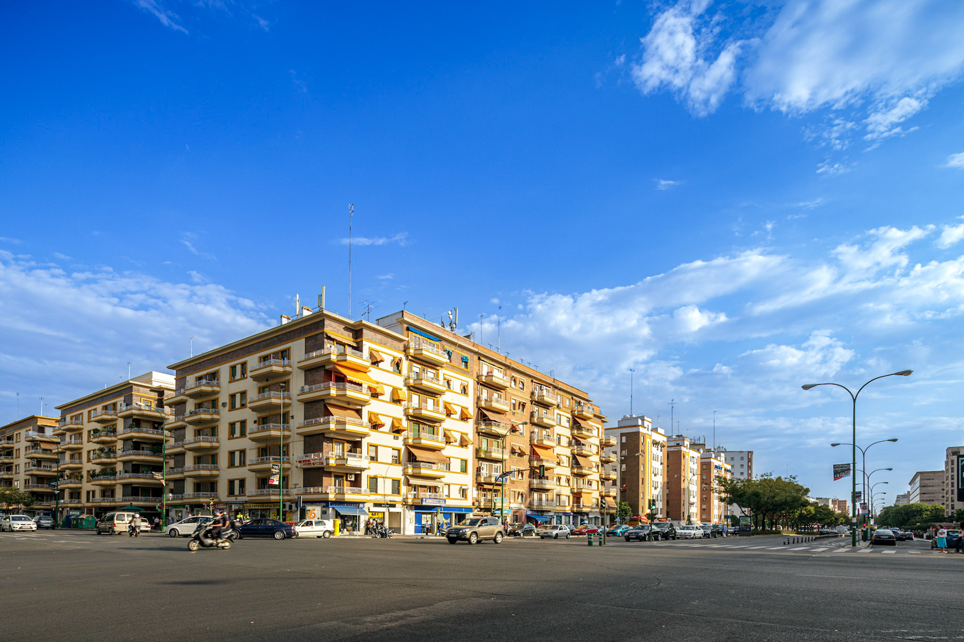 Captivating apartment buildings define Seville's Nervion district, viewed from Eduardo Dato and San Francisco Javier streets under a bright sky. Editorial.