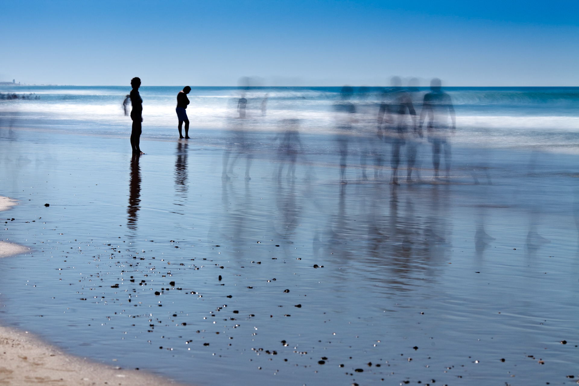 People on the beach. Daylight long exposure shot by the use of neutral density filters.