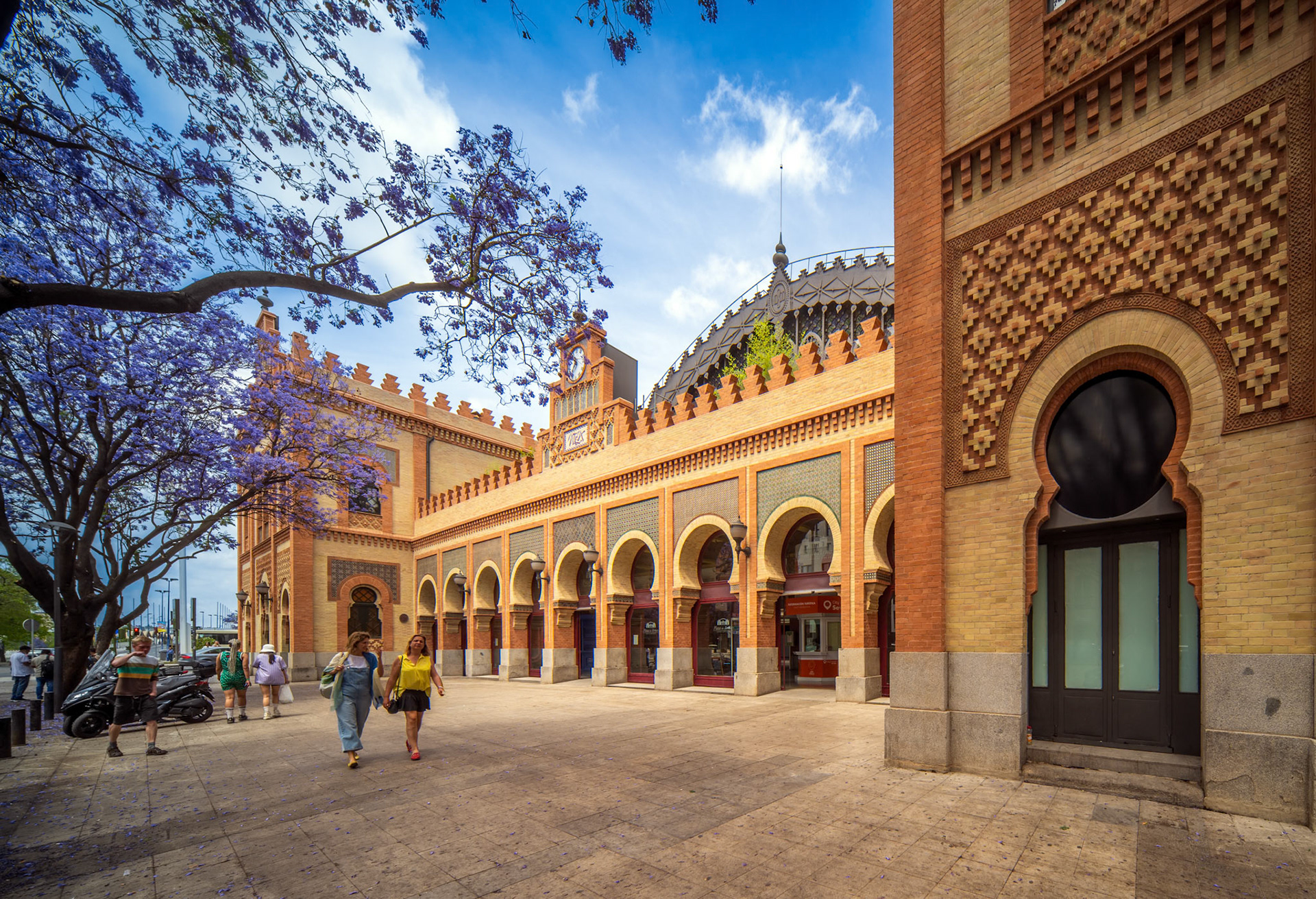 Seville, Spain, May 15 2022, Neo-Mudejar styled building with characteristic arches in Seville's historic Plaza de Armas area.
