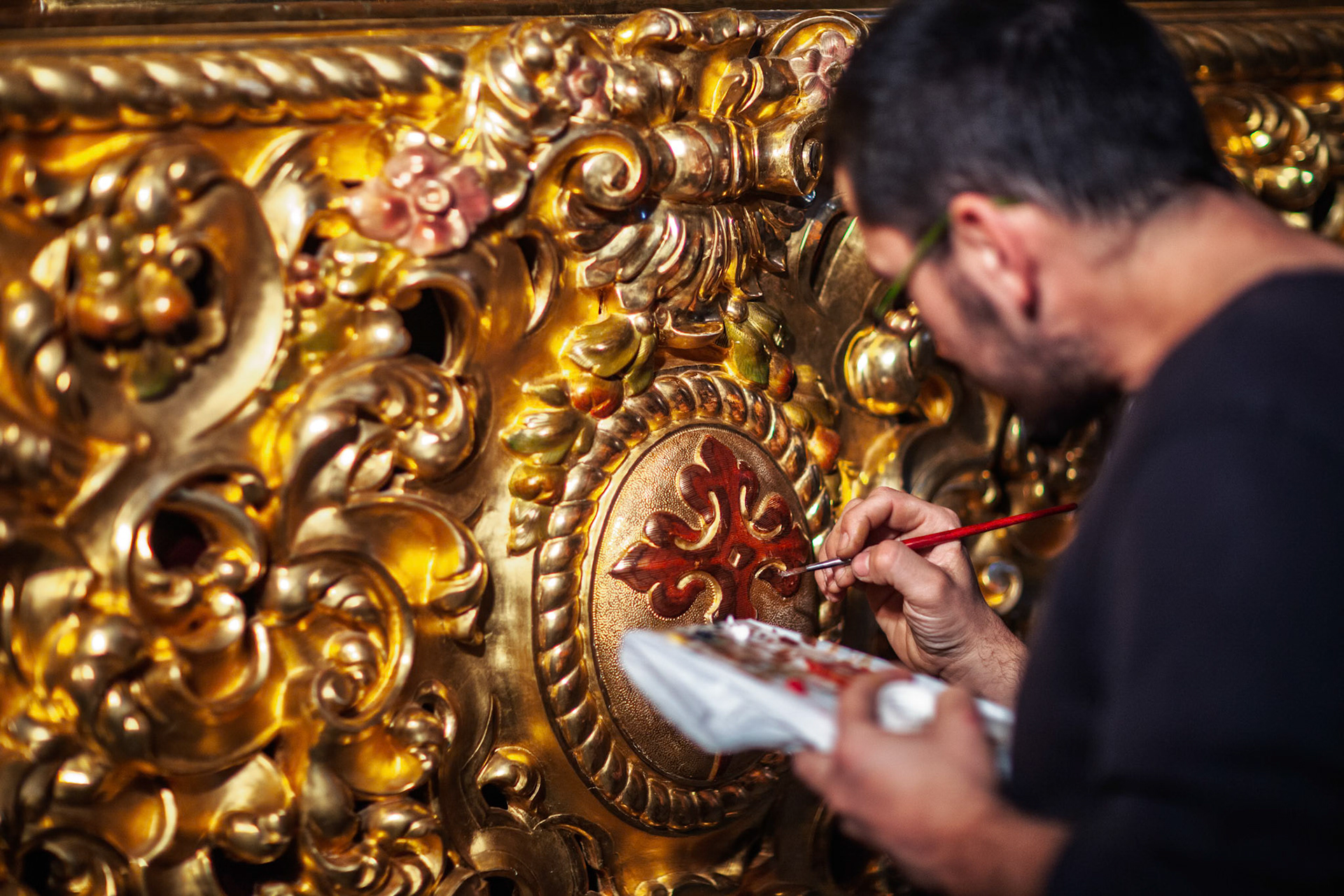 Seville, Spain, Apr 3 2009, A gilder meticulously enhances the paso of the Borriquita with intricate brushwork in Seville during the Holy Week festivities.
