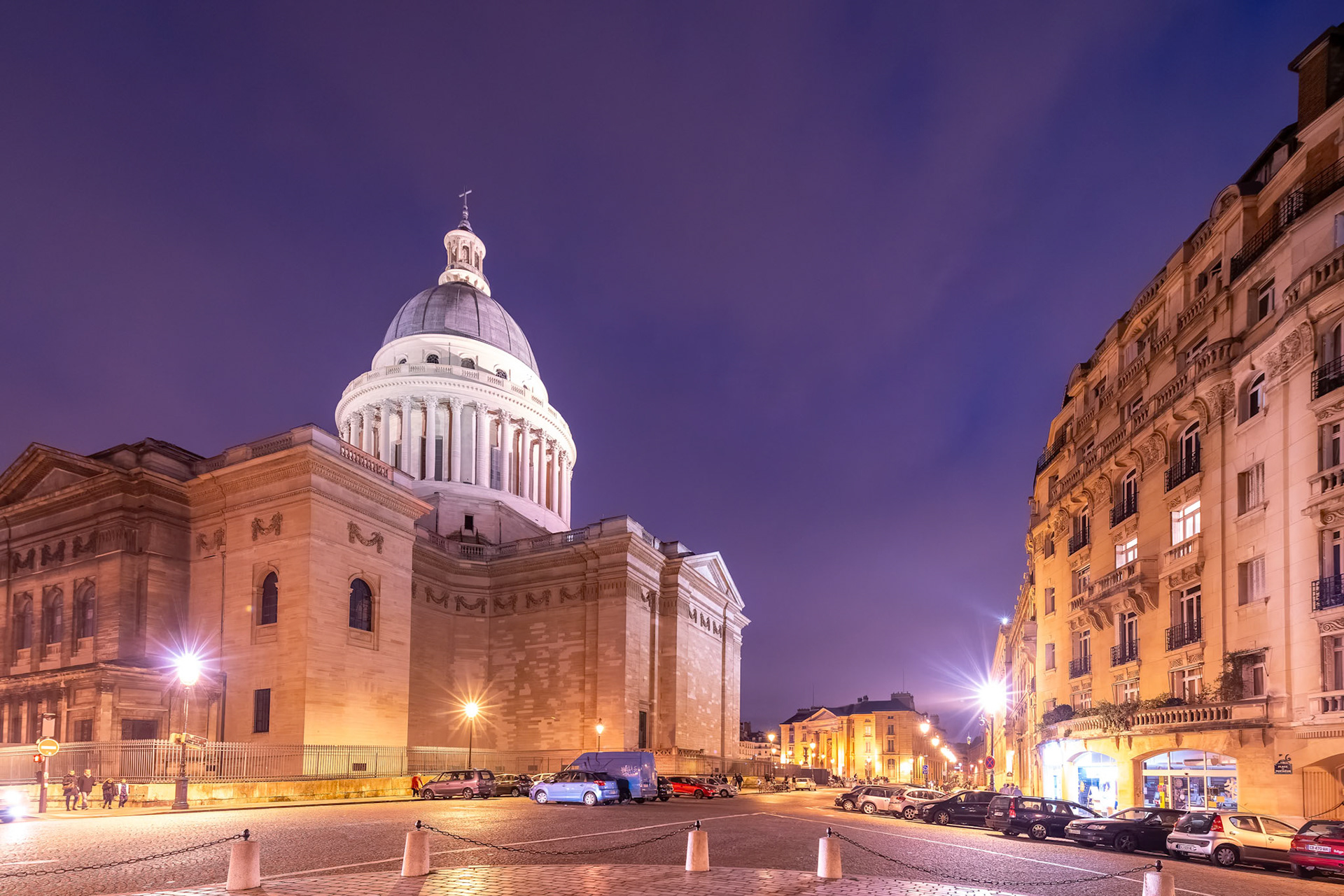 The Panthéon in Paris lit up against the twilight sky.